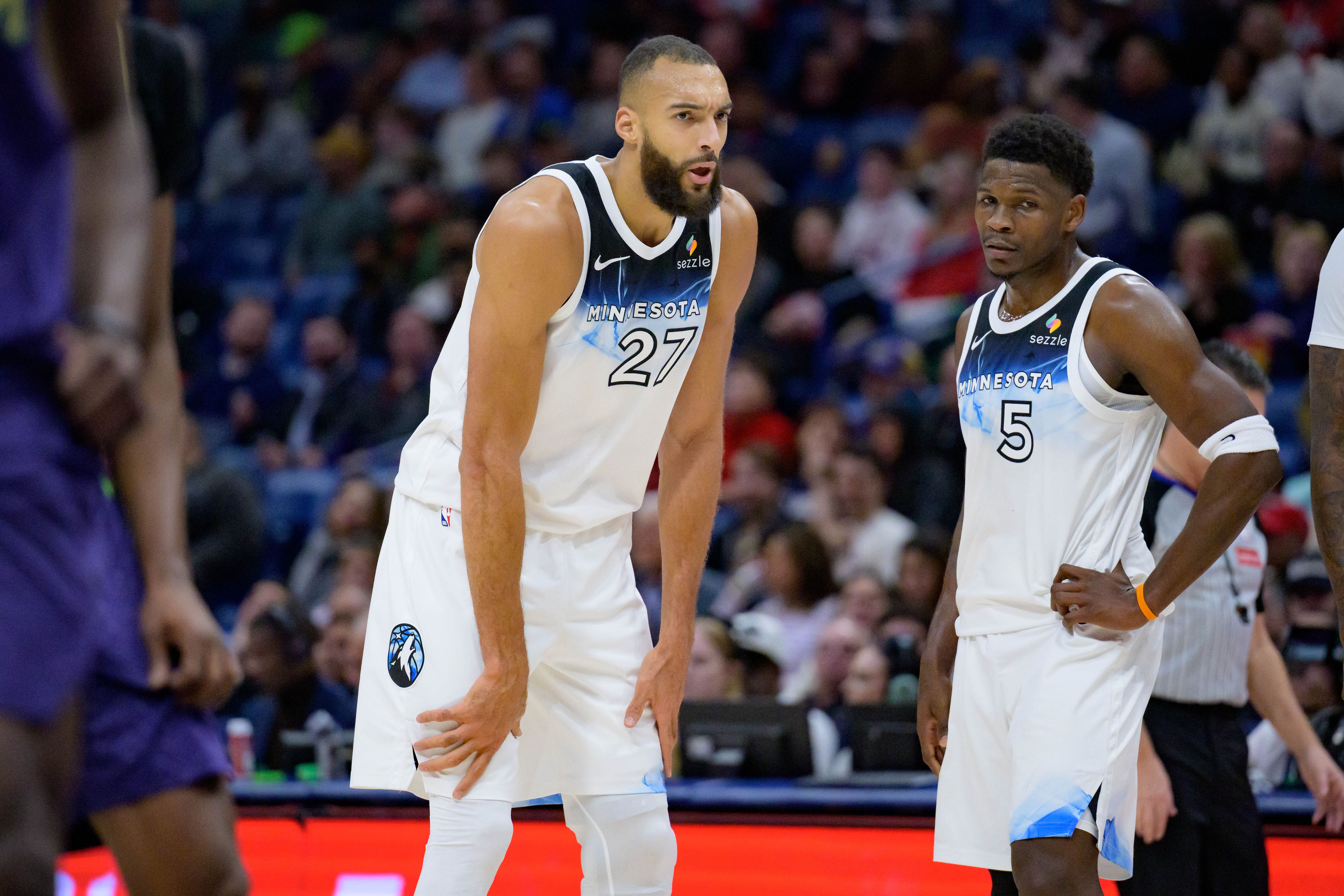 Jan 7, 2025; New Orleans, Louisiana, USA; Minnesota Timberwolves center Rudy Gobert (27) talks with Minnesota Timberwolves guard Anthony Edwards (5) against the New Orleans Pelicans during the first half at Smoothie King Center. Mandatory Credit: Matthew Hinton-Imagn Images - Source: Imagn