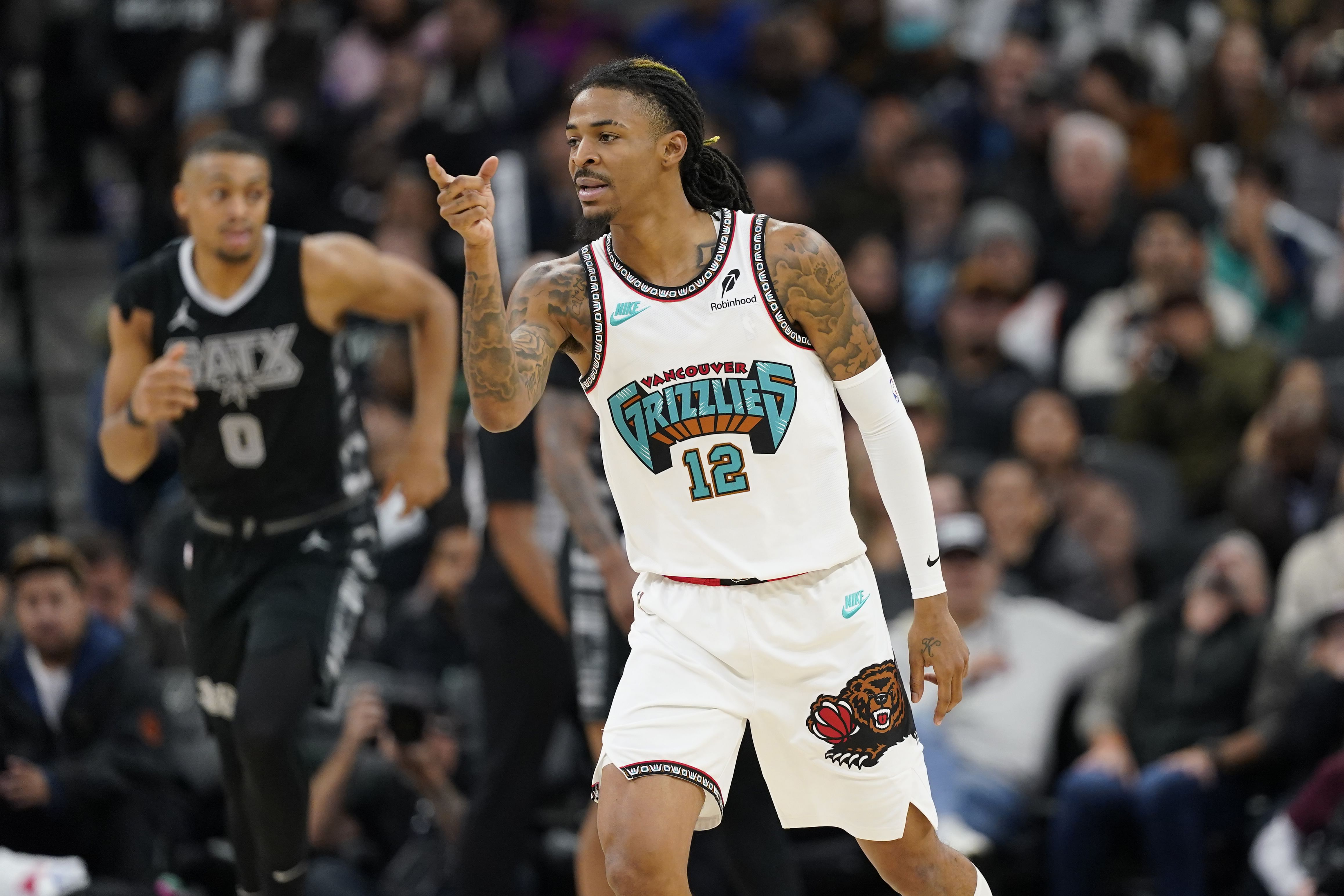 Memphis Grizzlies guard Ja Morant reacts after scoring a three point basket during the second half at Frost Bank Center. Photo Credit: Imagn