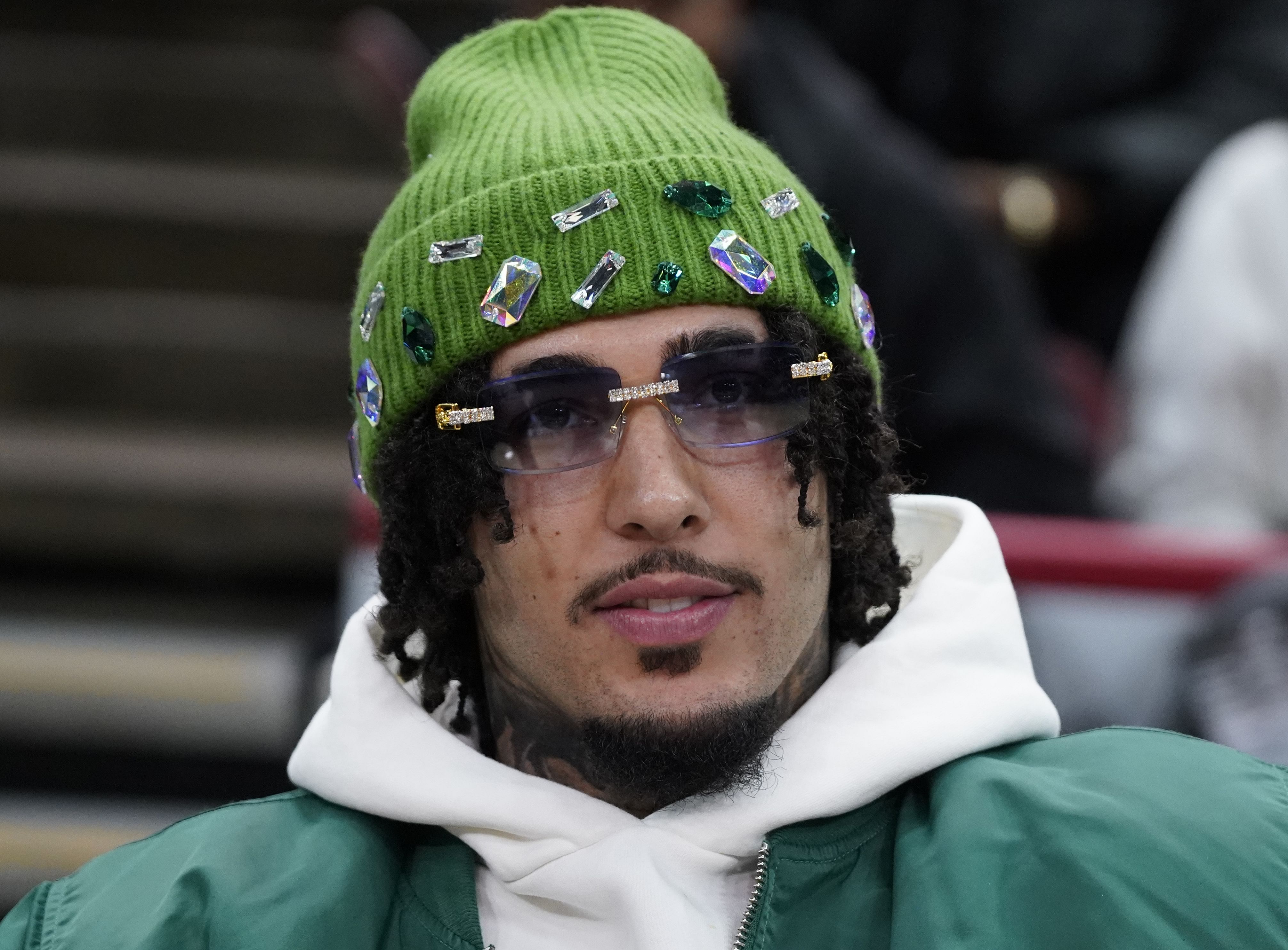 Rapper LiAngelo Ball watches his brothers Chicago Bulls guard Lonzo Ball and Charlotte Hornets guard LaMelo Ball at United Center. Photo Credit: Imagn