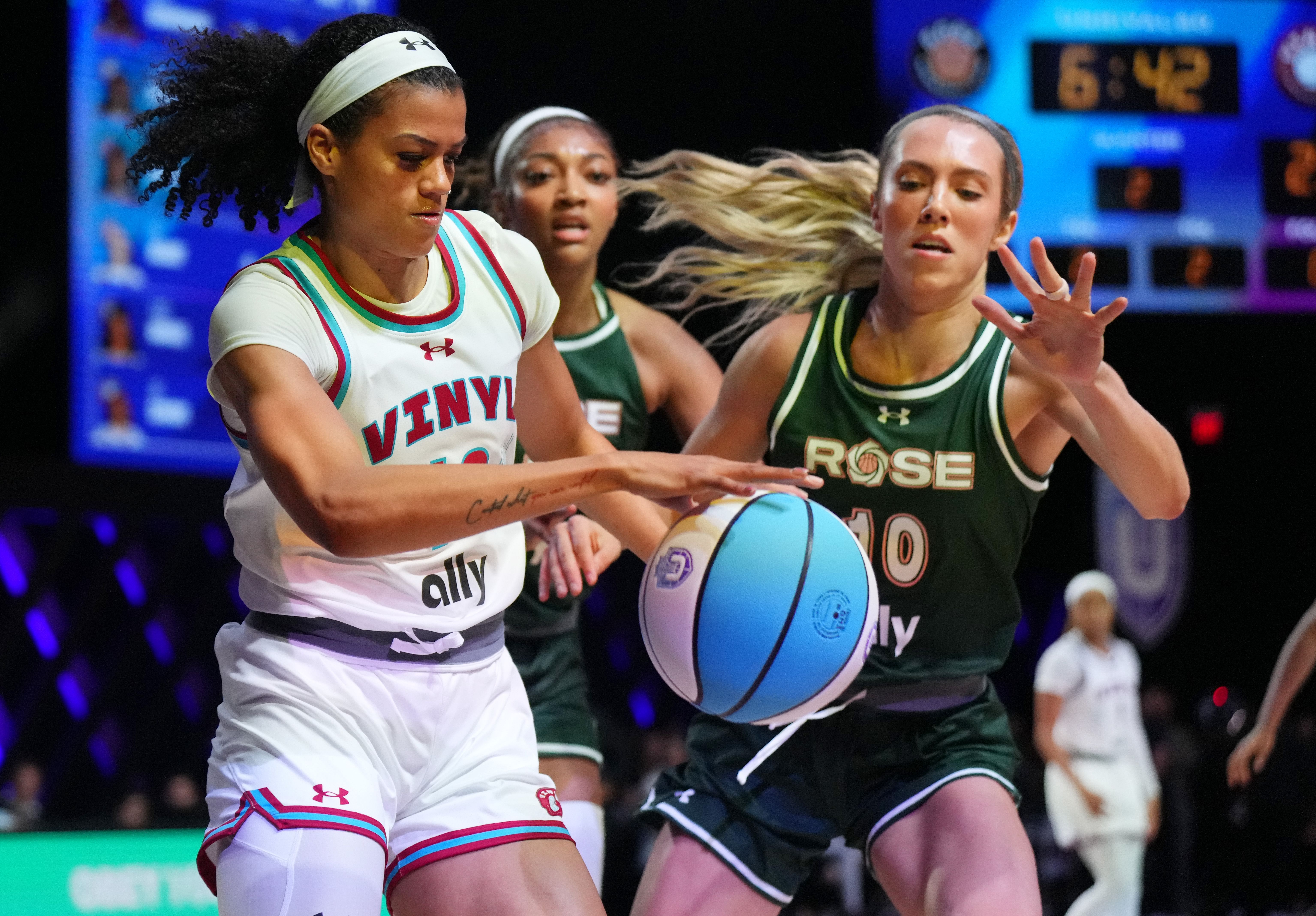 Rae Burrell of the Vinyl battles for possession with Lexie Hull and Angel Reese of the Rose at Wayfair Arena. Photo Credit: Imagn