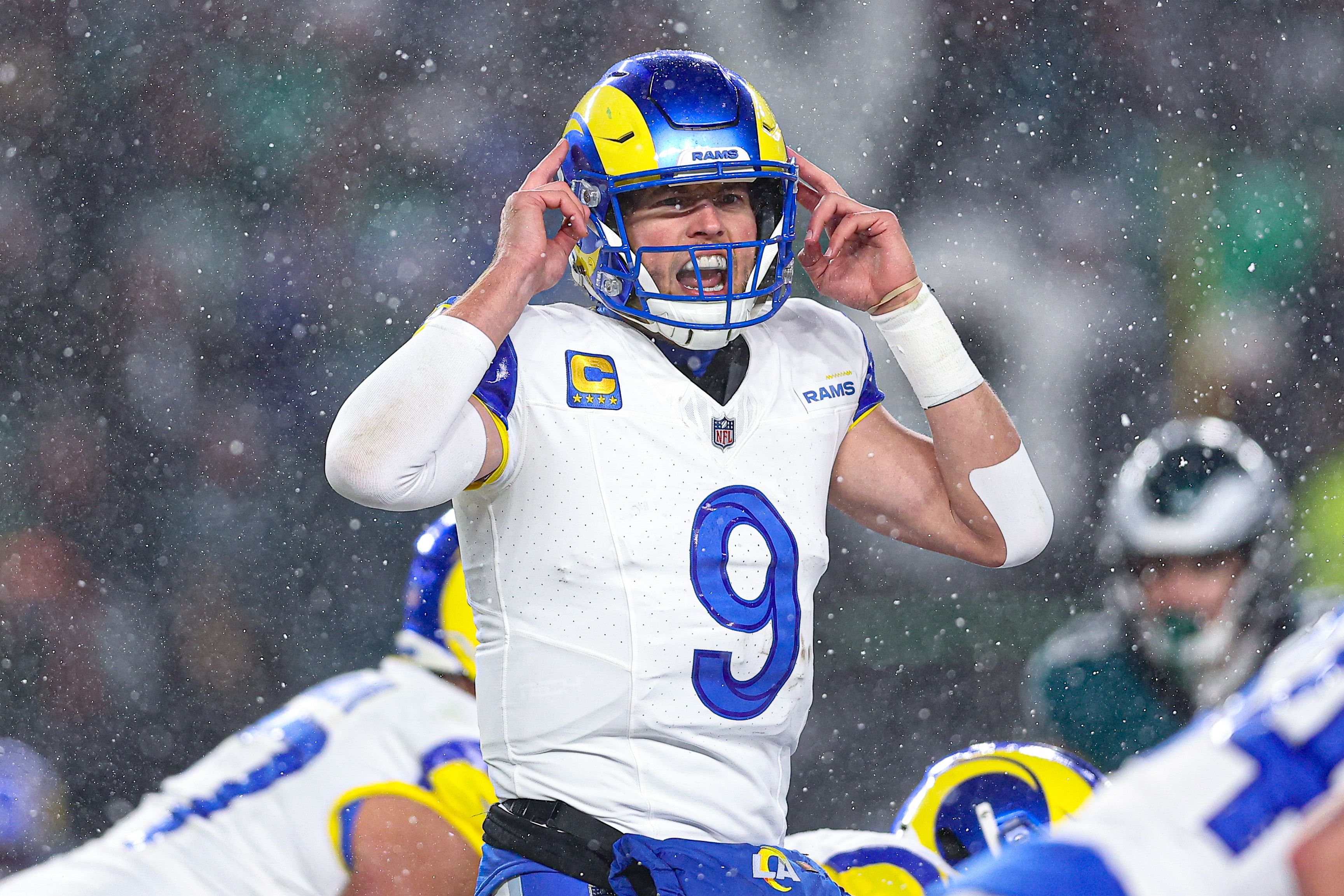 Jan 19, 2025; Philadelphia, Pennsylvania, USA; Los Angeles Rams quarterback Matthew Stafford (9) calls a play at the one of scrimmage against the Philadelphia Eagles in a 2025 NFC divisional round game at Lincoln Financial Field. Mandatory Credit: Bill Streicher-Imagn Images - Source: Imagn