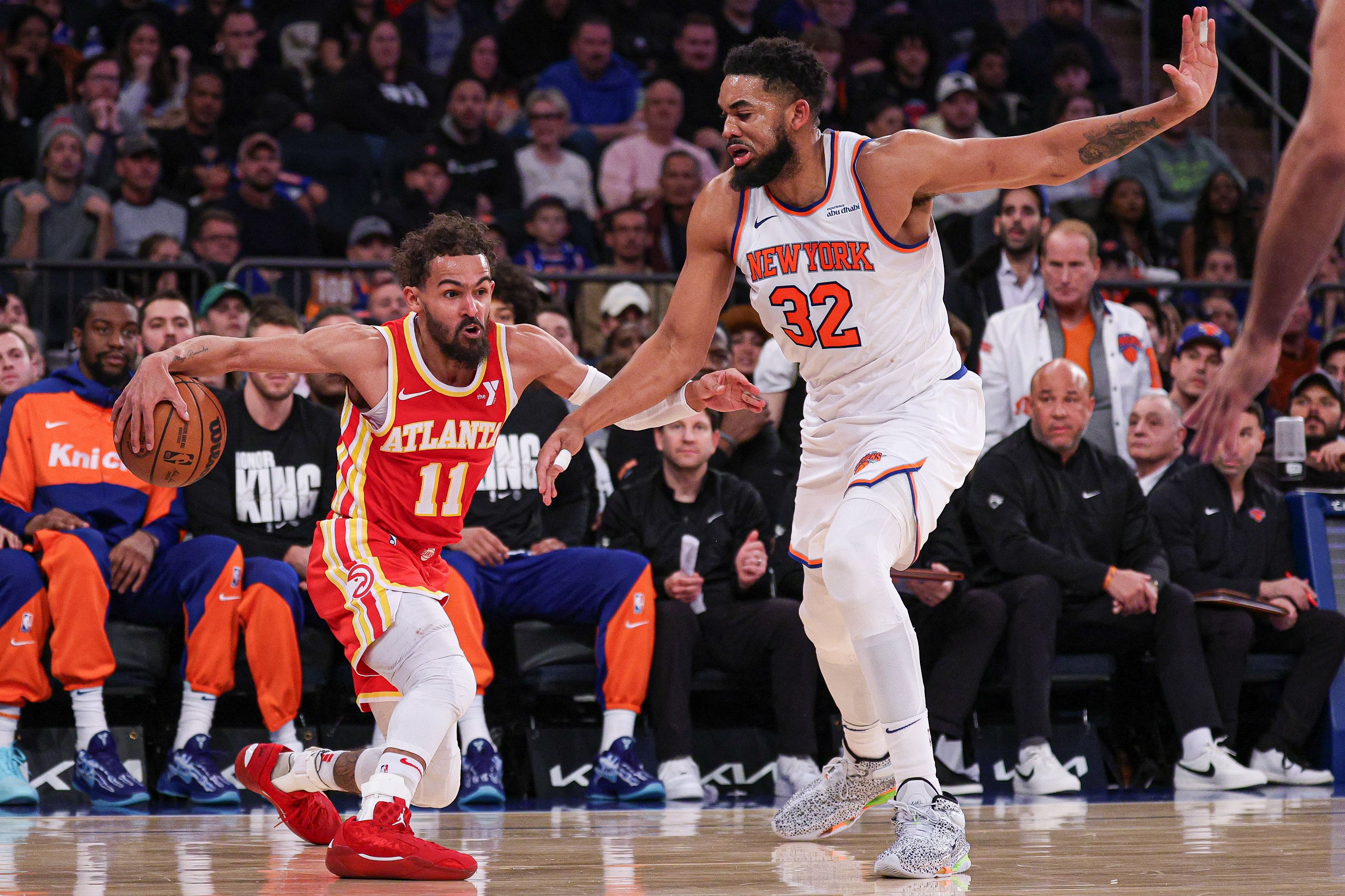 Jan 20, 2025; New York, New York, USA; Atlanta Hawks guard Trae Young (11) is guarded by New York Knicks center Karl-Anthony Towns (32) during the second half at Madison Square Garden. Mandatory Credit: Vincent Carchietta-Imagn Images - Source: Imagn