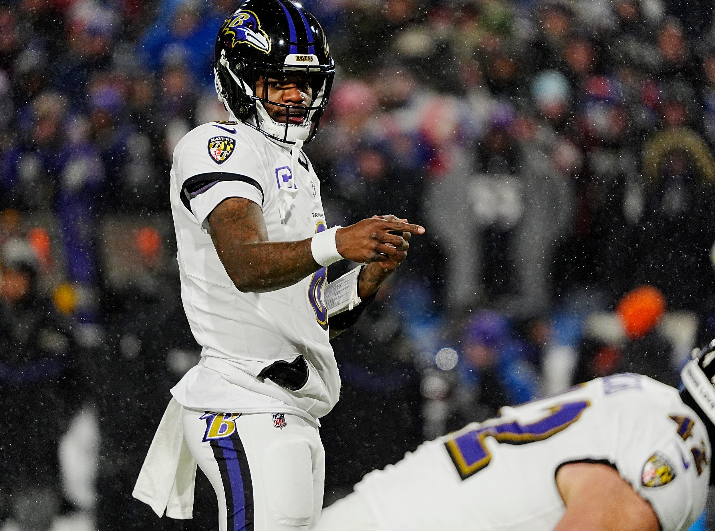 Lamar Jackson lines up to run a play - Source: Imagn