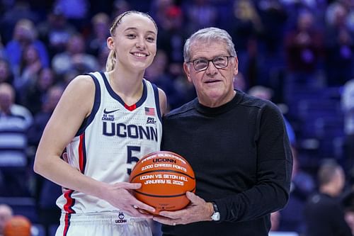 UConn Huskies guard Paige Bueckers (#5) is recognized with head coach Geno Auriemma for her 2000 career points before the start of their showdown against the Villanova Wildcats. Photo: Imagn