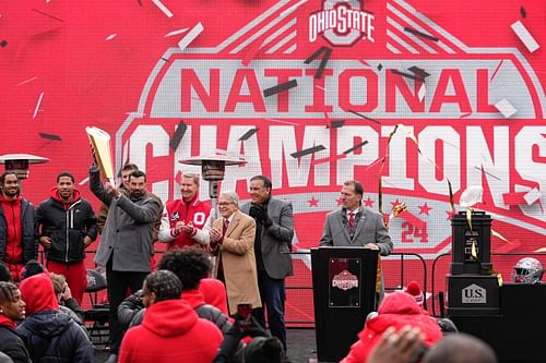 Buckeyes coach Day hoists the College Football Playoff trophy - Source: Imagn