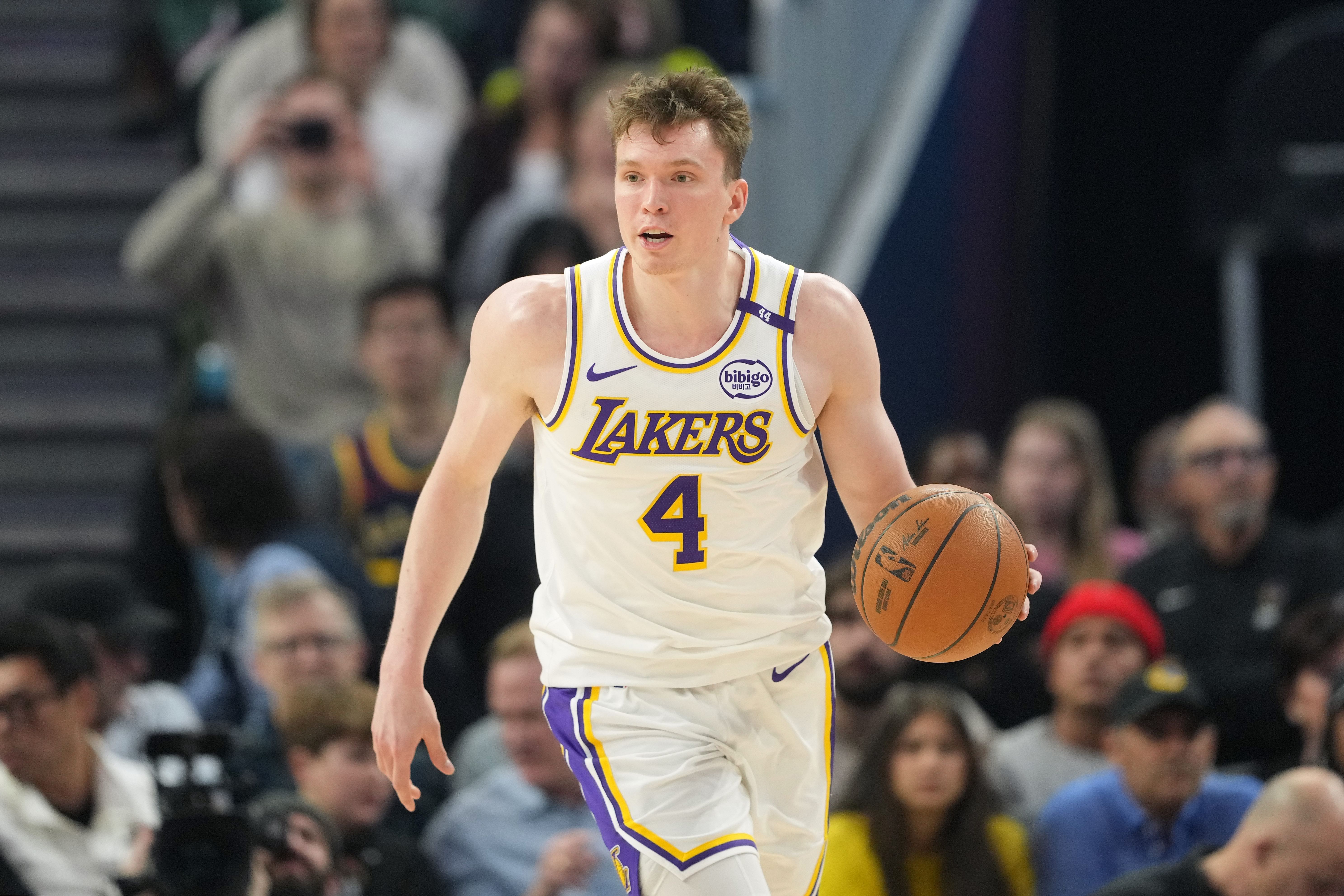 Los Angeles Lakers guard Dalton Knecht (4) dribbles against the Golden State Warriors during the second quarter at Chase Center. Mandatory Credit: Darren Yamashita-Imagn Images