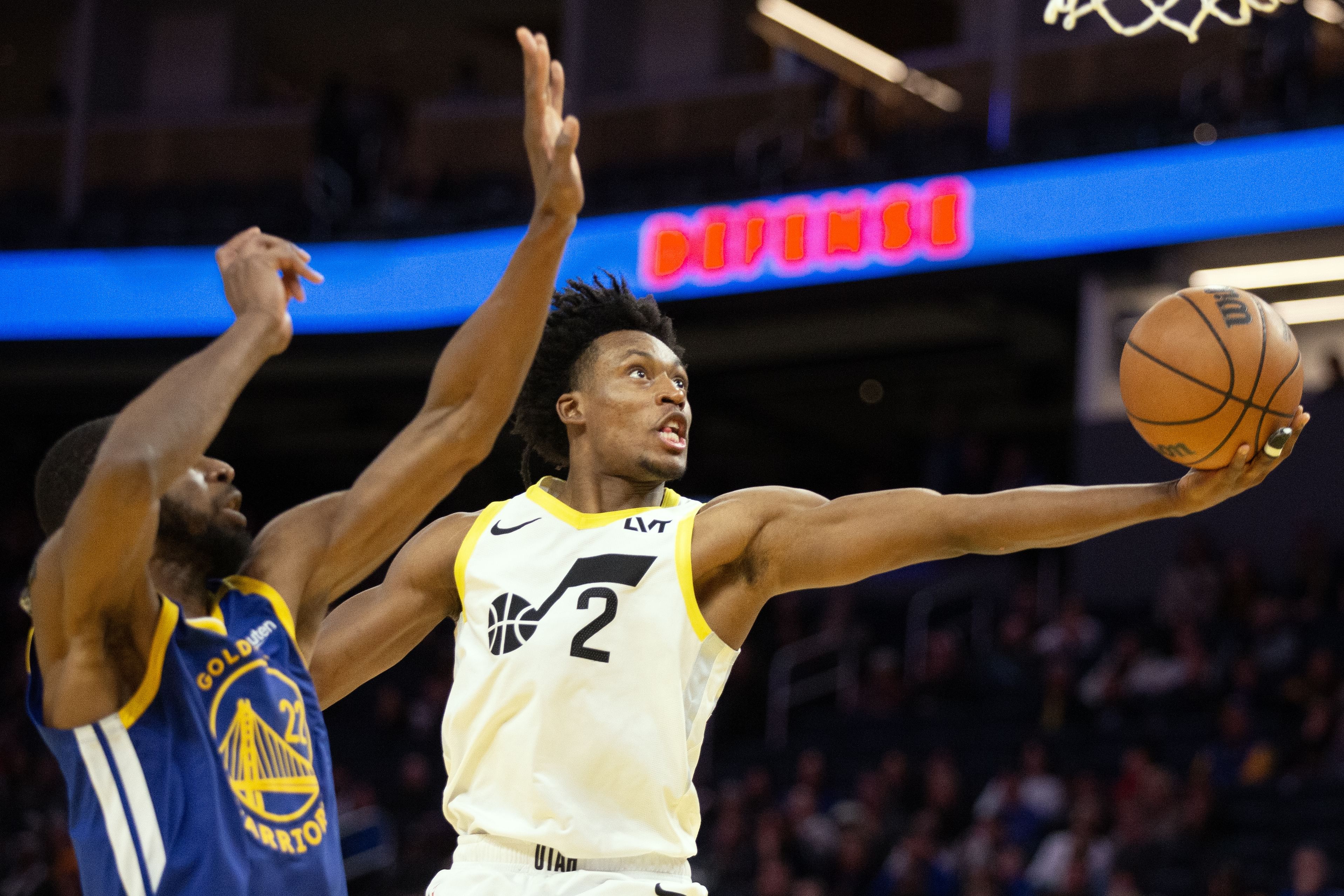 Jan 28, 2025; San Francisco, California, USA; Utah Jazz guard Collin Sexton (2) drives to the basket ahead of Golden State Warriors forward Andrew Wiggins (22) during the fourth quarter at Chase Center. Mandatory Credit: D. Ross Cameron-Imagn Images - Source: Imagn