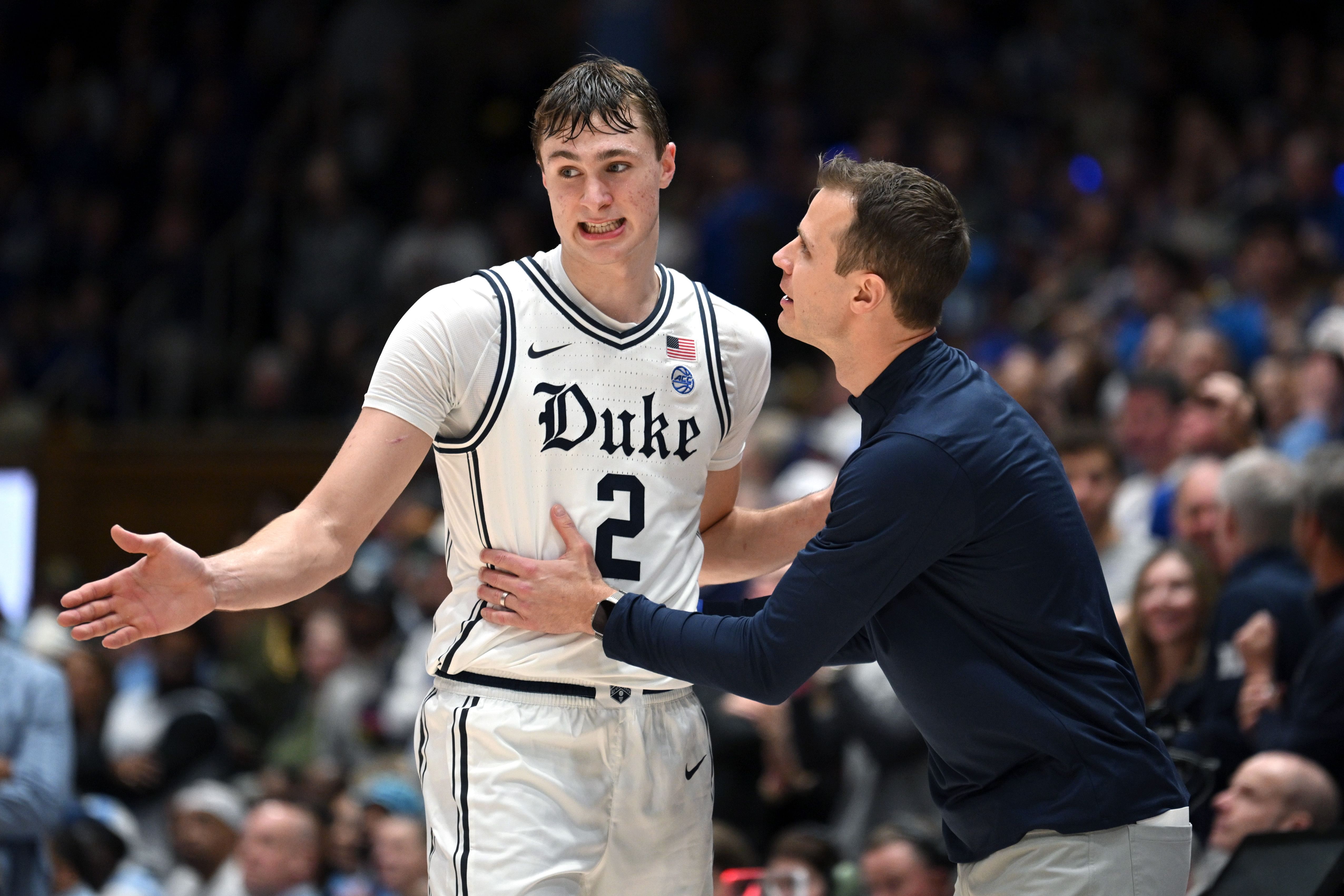 Duke Blue Devils head coach Jon Scheyer talks with forward Cooper Flagg (#2) in the second half against the North Carolina Tar Heels at Cameron Indoor Stadium. Photo: Imagn