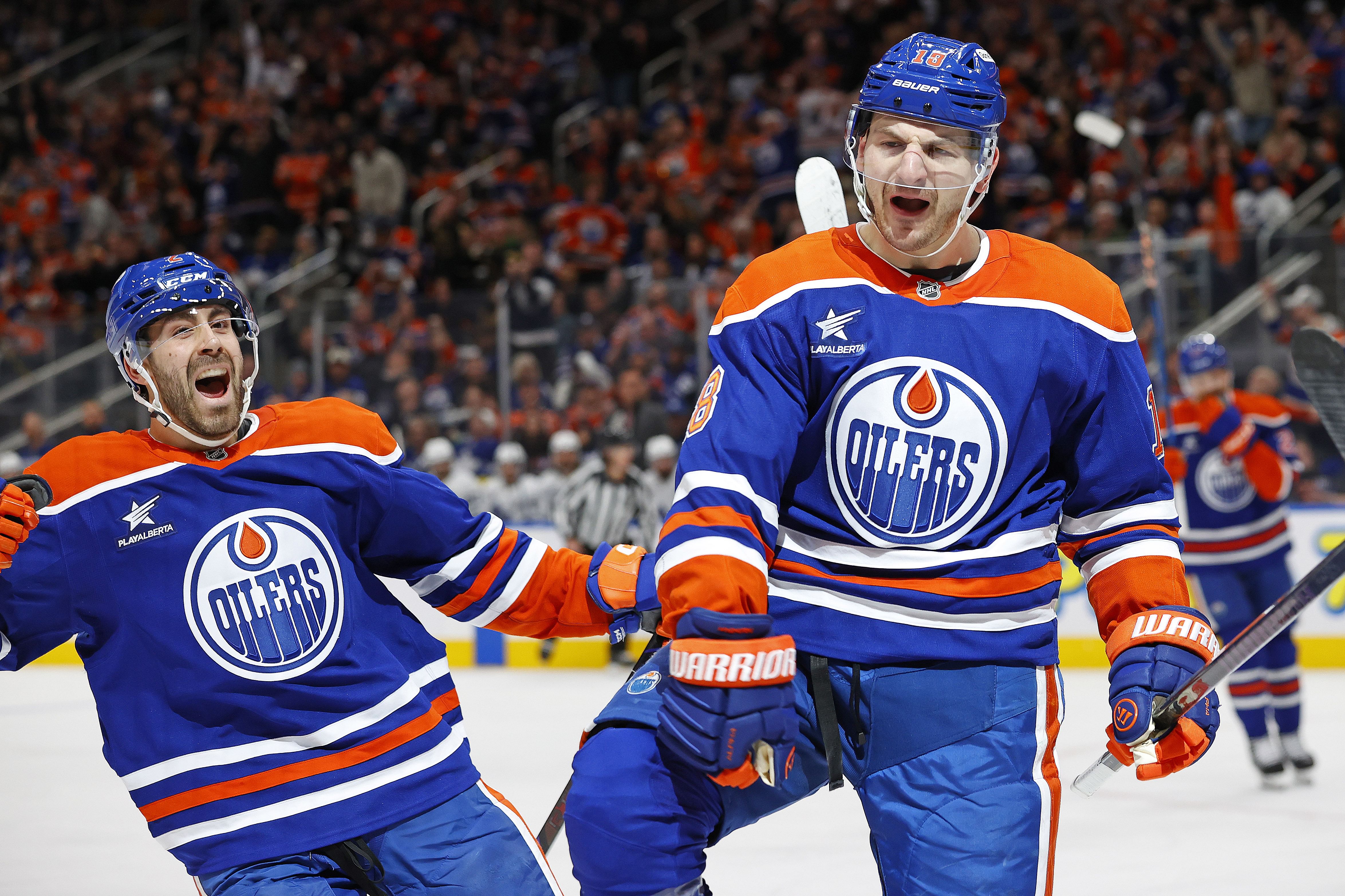 Feb 1, 2025; Edmonton, Alberta, CAN; Edmonton Oilers forward Zach Hyman (18) celebrates after scoring a goal against the Toronto Maple Leafs during the third period at Rogers Place. Mandatory Credit: Perry Nelson-Imagn Images - Source: Imagn