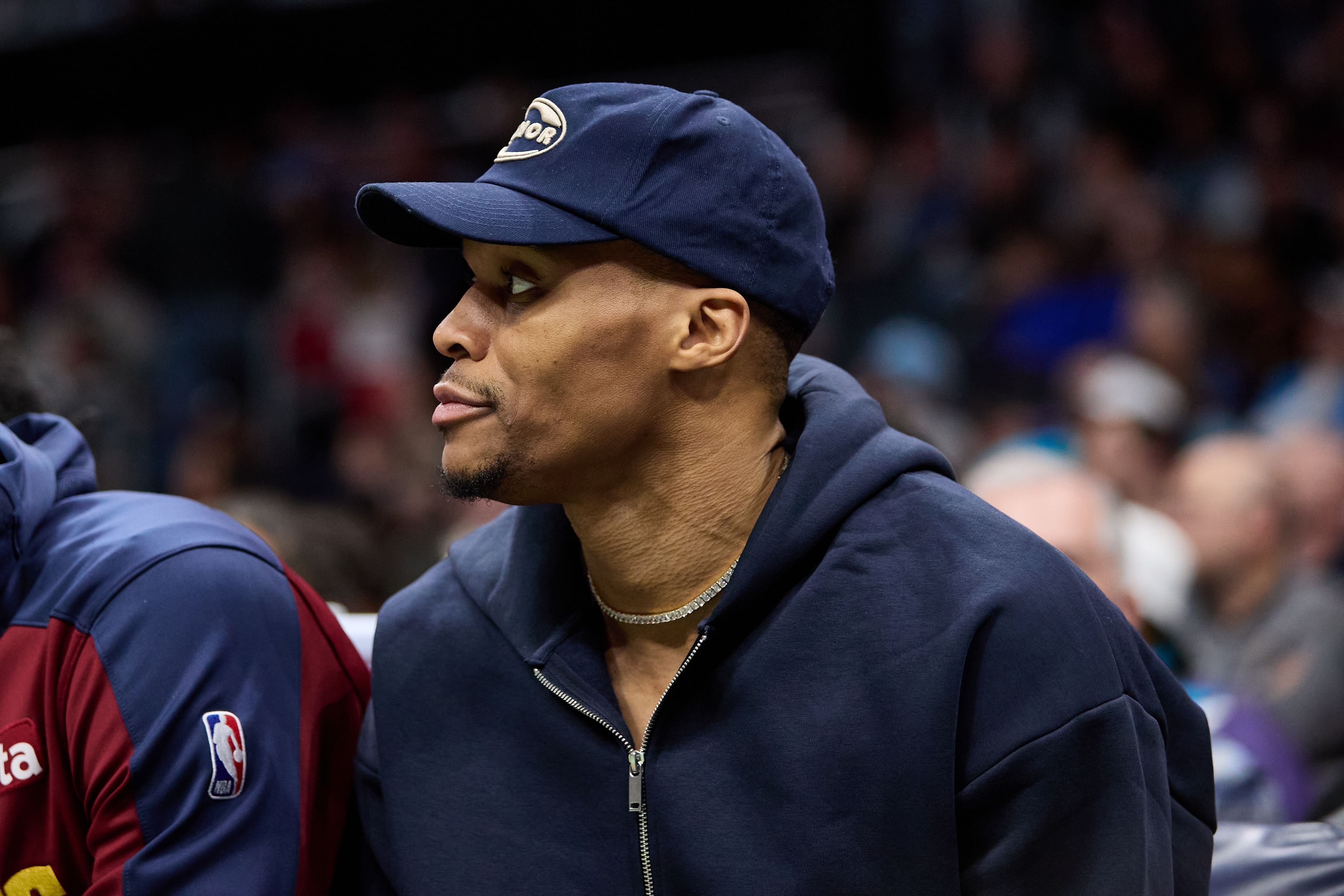 Feb 1, 2025; Charlotte, North Carolina, USA; Denver Nuggets guard Russell Westbrook watches from the bench during the second half of play against the Charlotte Hornets at Spectrum Center. Mandatory Credit: Brian Westerholt-Imagn Images - Source: Imagn