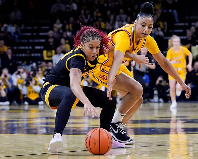 "Thought JuJu Watkins was better than Paige Bueckers and Caitlin Clark": Hoops fans react to Iowa taking down USC with Hawkeyes icon in attendance