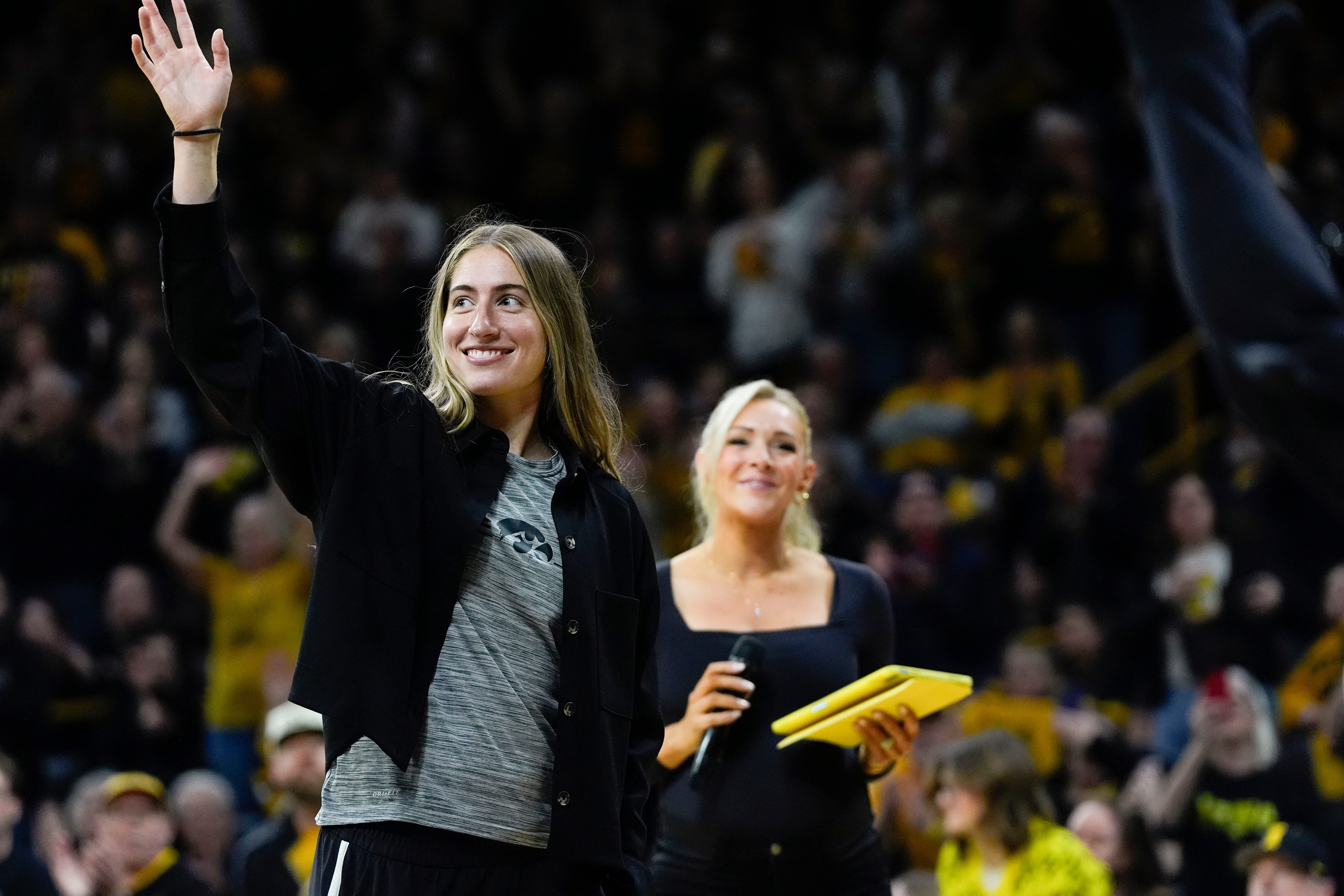 Kate Martin, a former Iowa women&rsquo;s basketball player, waves to the crowd during a timeout at a Big Ten women&rsquo;s basketball game against the USC Trojans Sunday, Feb. 2, 2025 at Carver-Hawkeye Arena in Iowa City, Iowa. - Source: Imagn