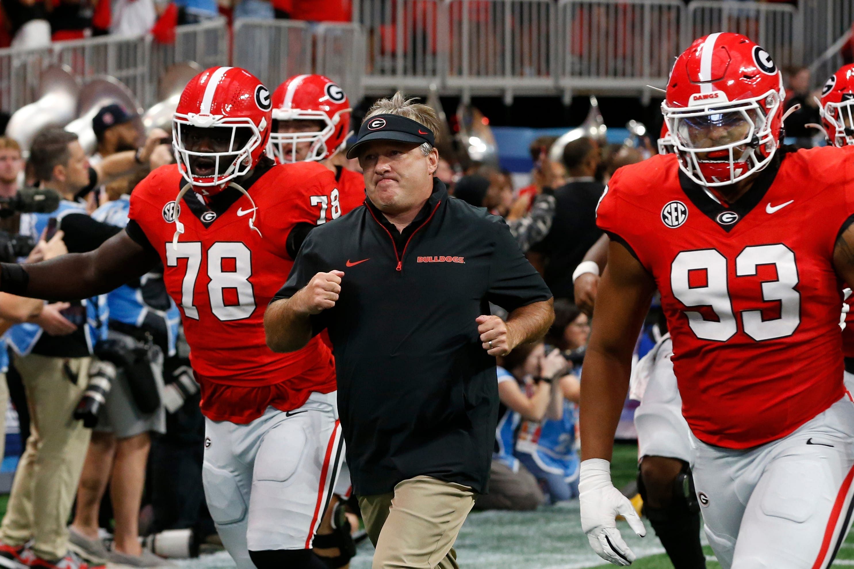 Georgia coach Kirby Smart leads his team onto the field before the start of the NCAA Aflac Kickoff Game in Atlanta, on Saturday, Aug. 31, 2024. - Source: Imagn