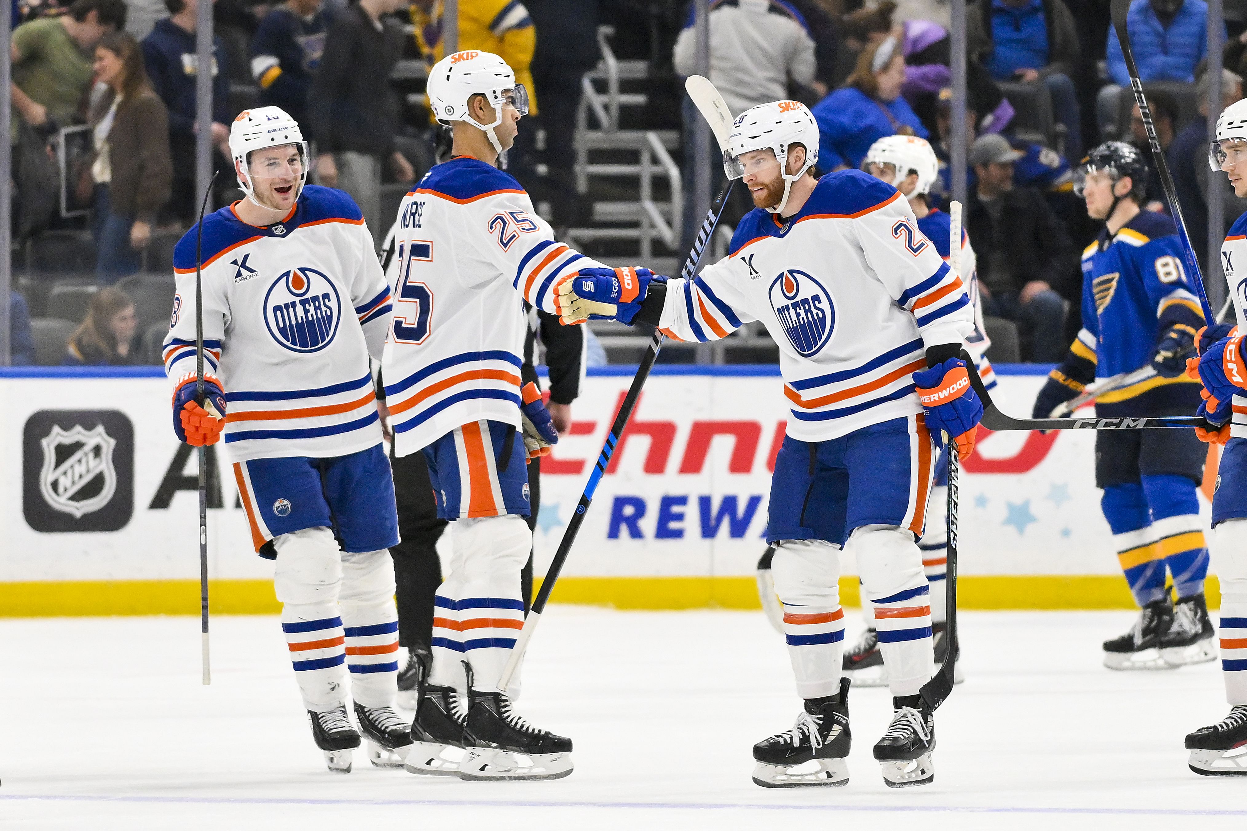 Feb 4, 2025; St. Louis, Missouri, USA; Edmonton Oilers right wing Connor Brown (28) is congratulated by defenseman Darnell Nurse (25) after scoring the game winning goal against the St. Louis Blues in overtime at Enterprise Center. Mandatory Credit: Jeff Curry-Imagn Images - Source: Imagn