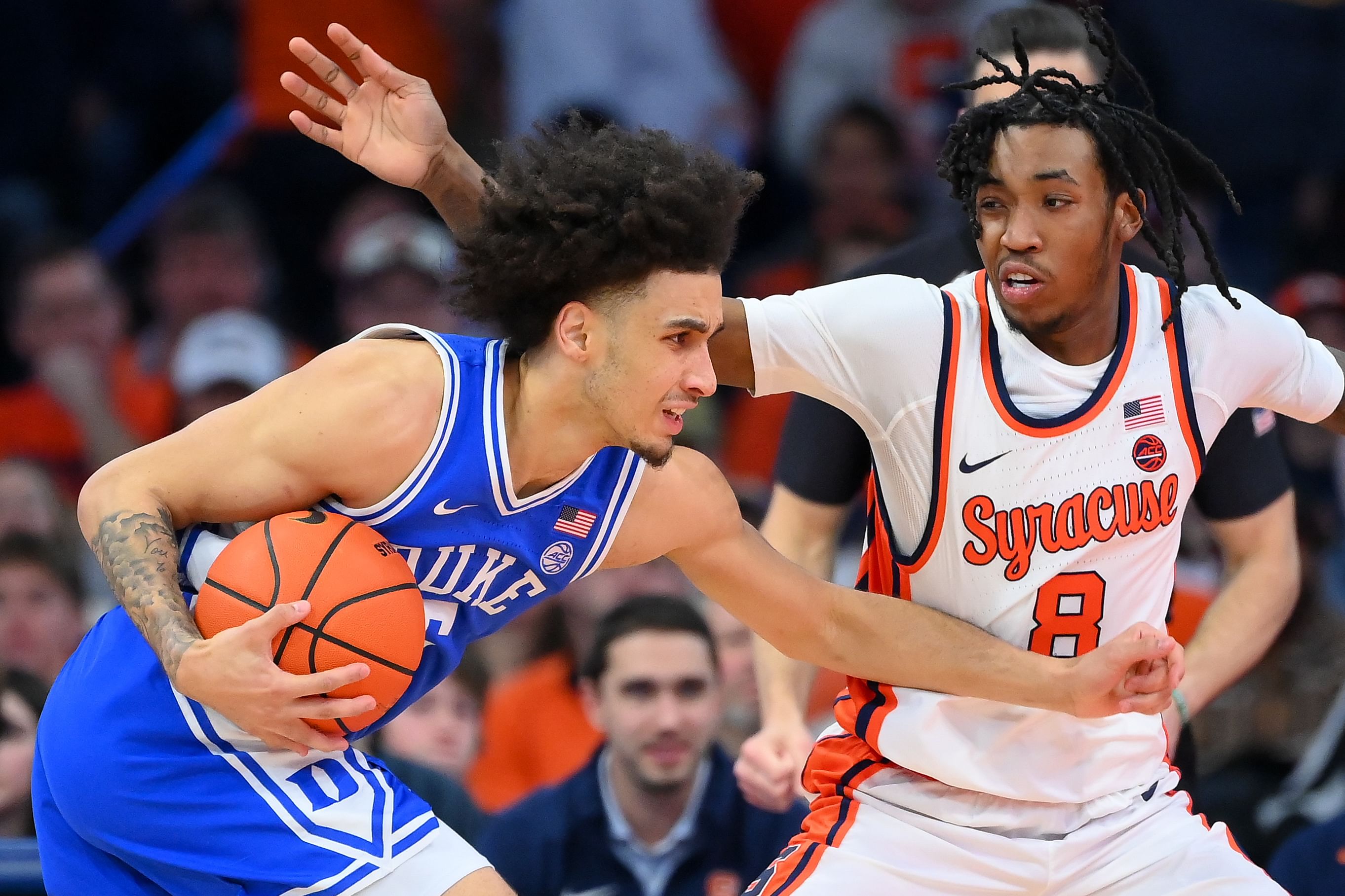 Duke Blue Devils guard Tyrese Proctor (5) drives against Syracuse Orange guard Elijah Moore (8) during the second half at the JMA Wireless Dome. Photo: Imagn