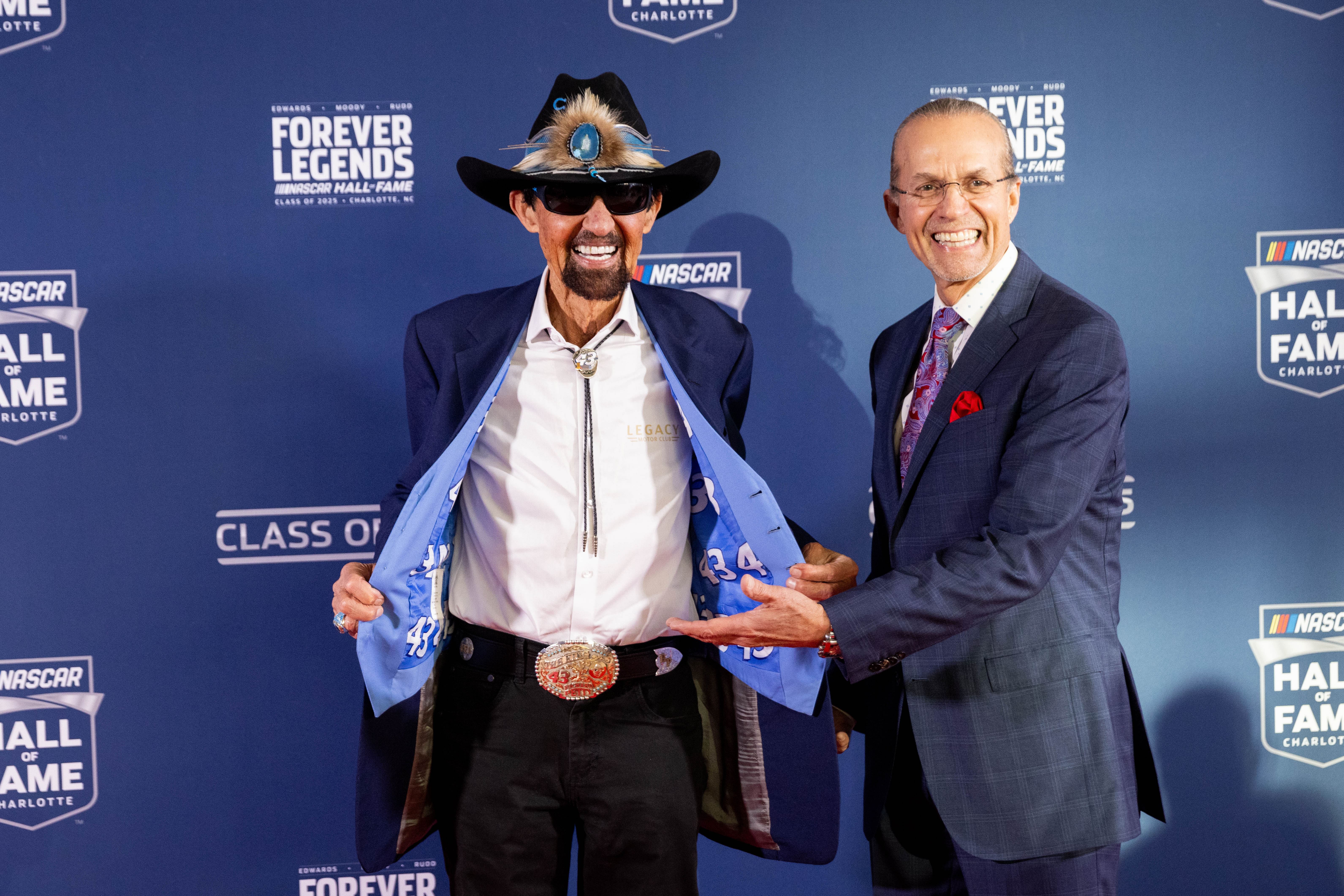 Former NASCAR drivers Richard Petty shows off custom vest with his son Kyle Petty - Source: Imagn