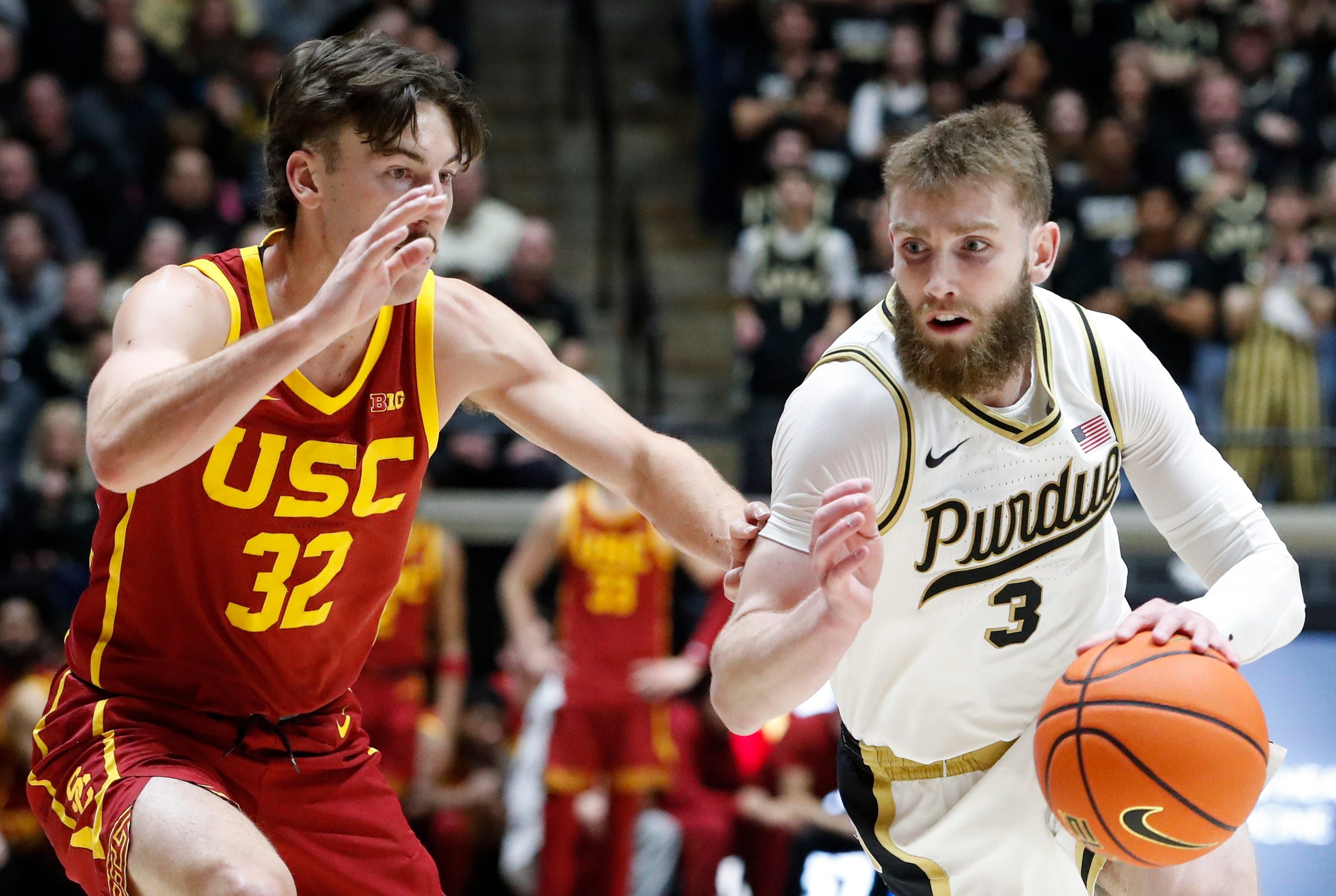 USC Trojans guard Clark Slajchert defends Purdue Boilermakers guard Braden Smith on Friday during their game at Mackey Arena. Photo: Imagn