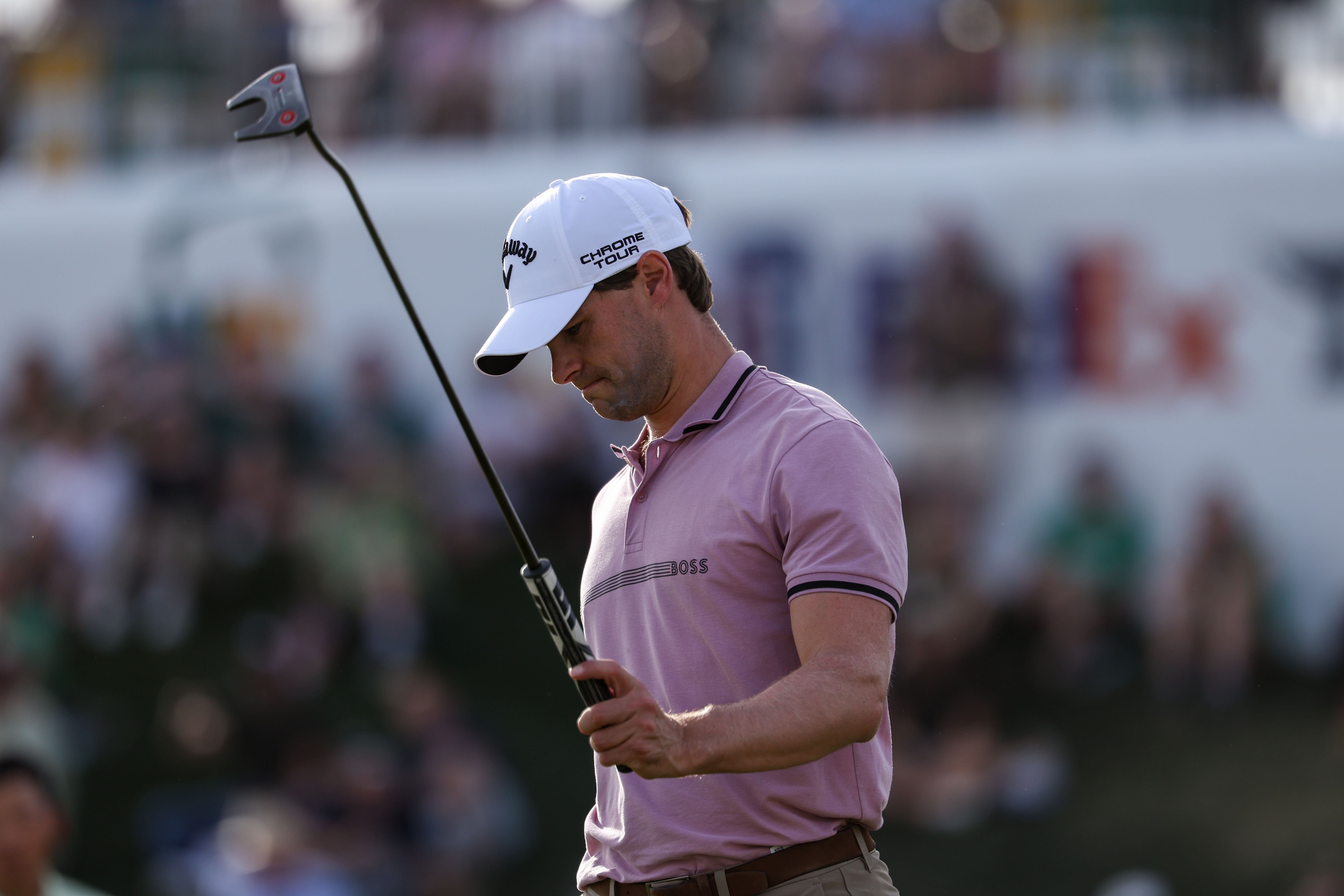 Thomas Detry holds his club up after his ball goes into the 18th hole during the third round of the WM Phoenix Open  - Source: Imagn