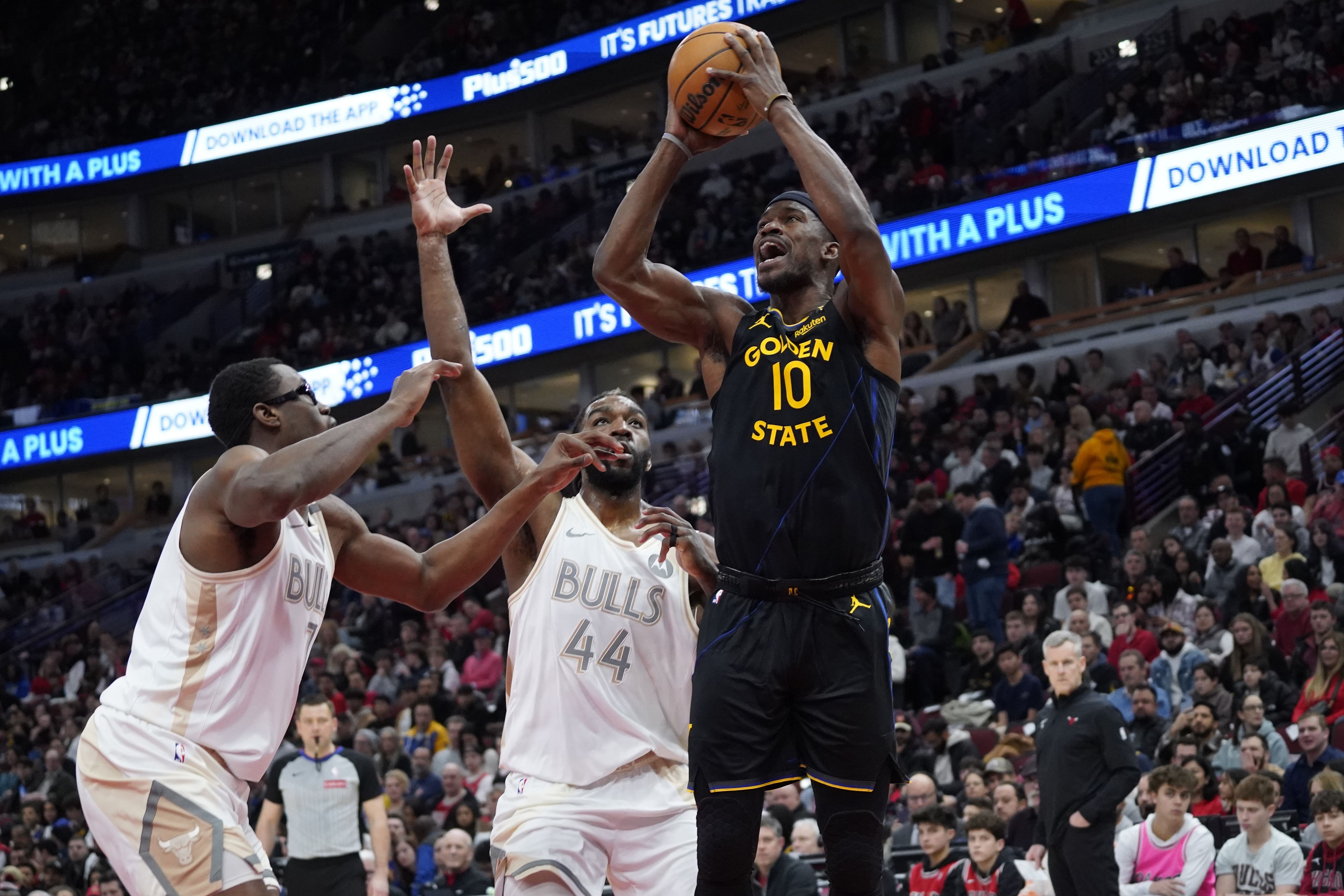 Feb 8, 2025; Chicago, Illinois, USA; Chicago Bulls forward Jalen Smith (7) and forward Patrick Williams (44) defend Golden State Warriors forward Jimmy Butler (10) during the first half at United Center. Mandatory Credit: David Banks-Imagn Images - Source: Imagn