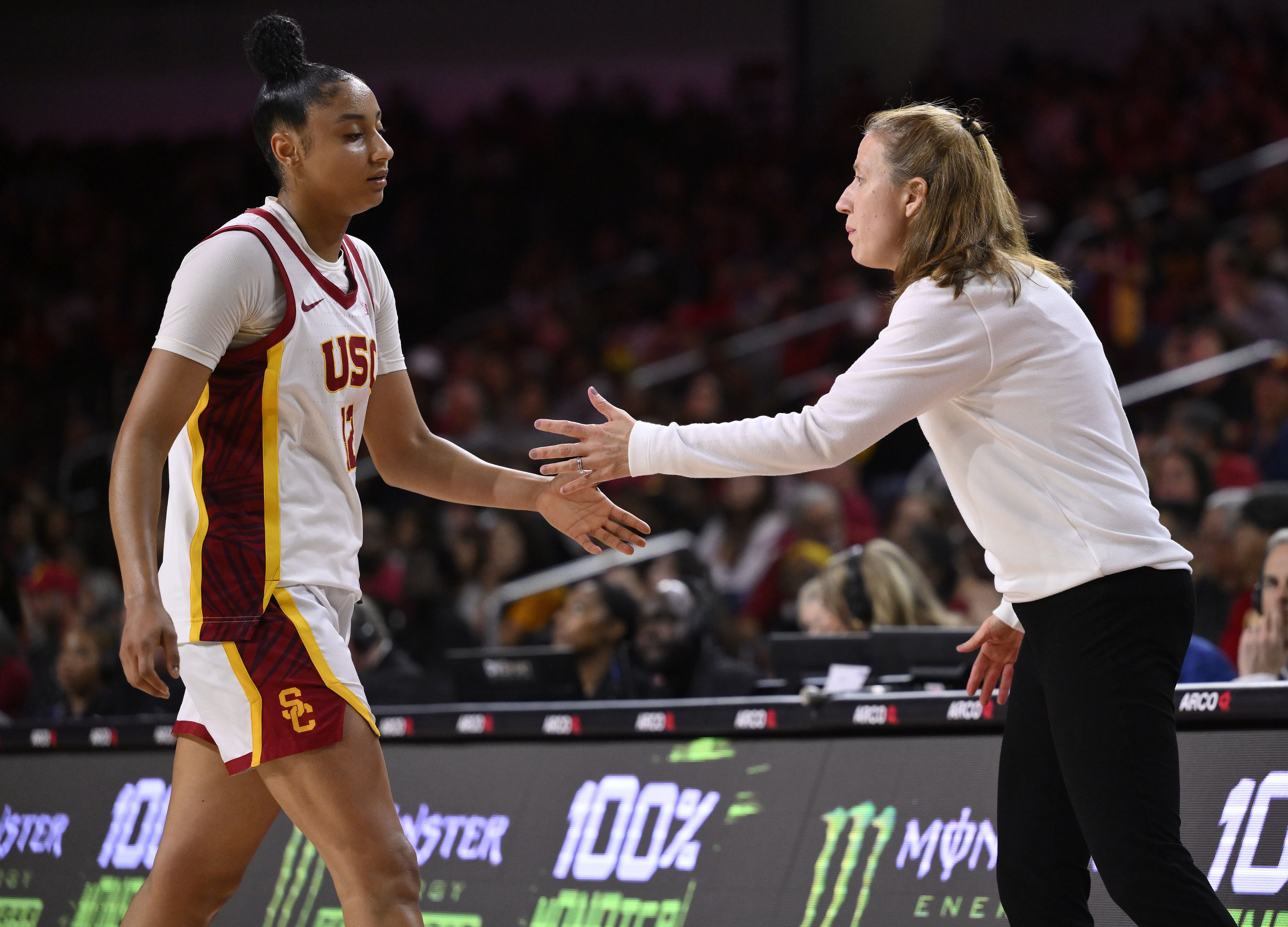 USC Trojans guard JuJu Watkins (#12) celebrates with head coach Lindsay Gottlieb in the fourth quarter of their NCAA basketball game against the Ohio State Buckeyes at Galen Center. Photo: Imagn