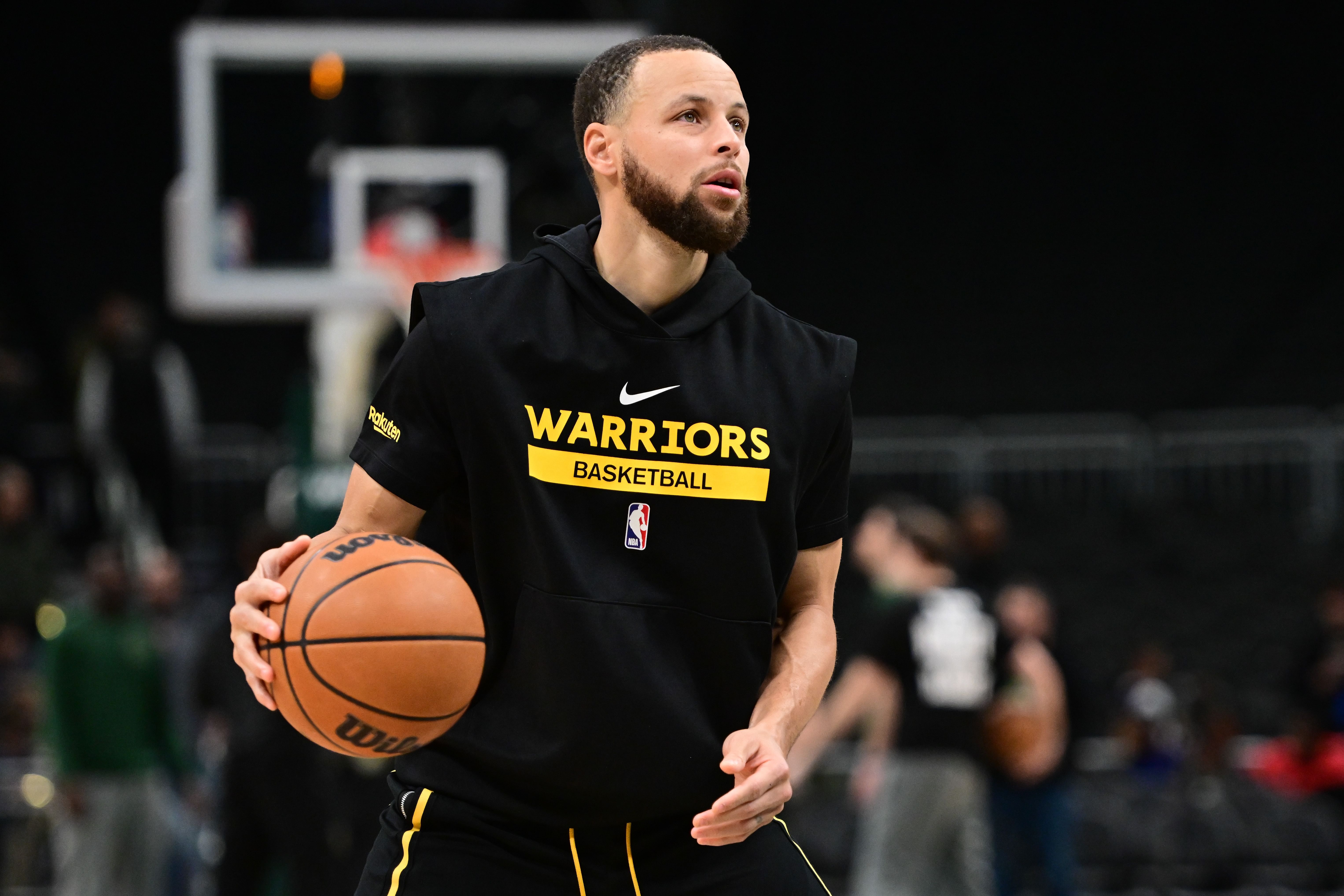 Feb 10, 2025; Milwaukee, Wisconsin, USA; Golden State Warriors guard Stephen Curry (30) warms up before game against the Milwaukee Bucks at Fiserv Forum. Mandatory Credit: Benny Sieu-Imagn Images - Source: Imagn