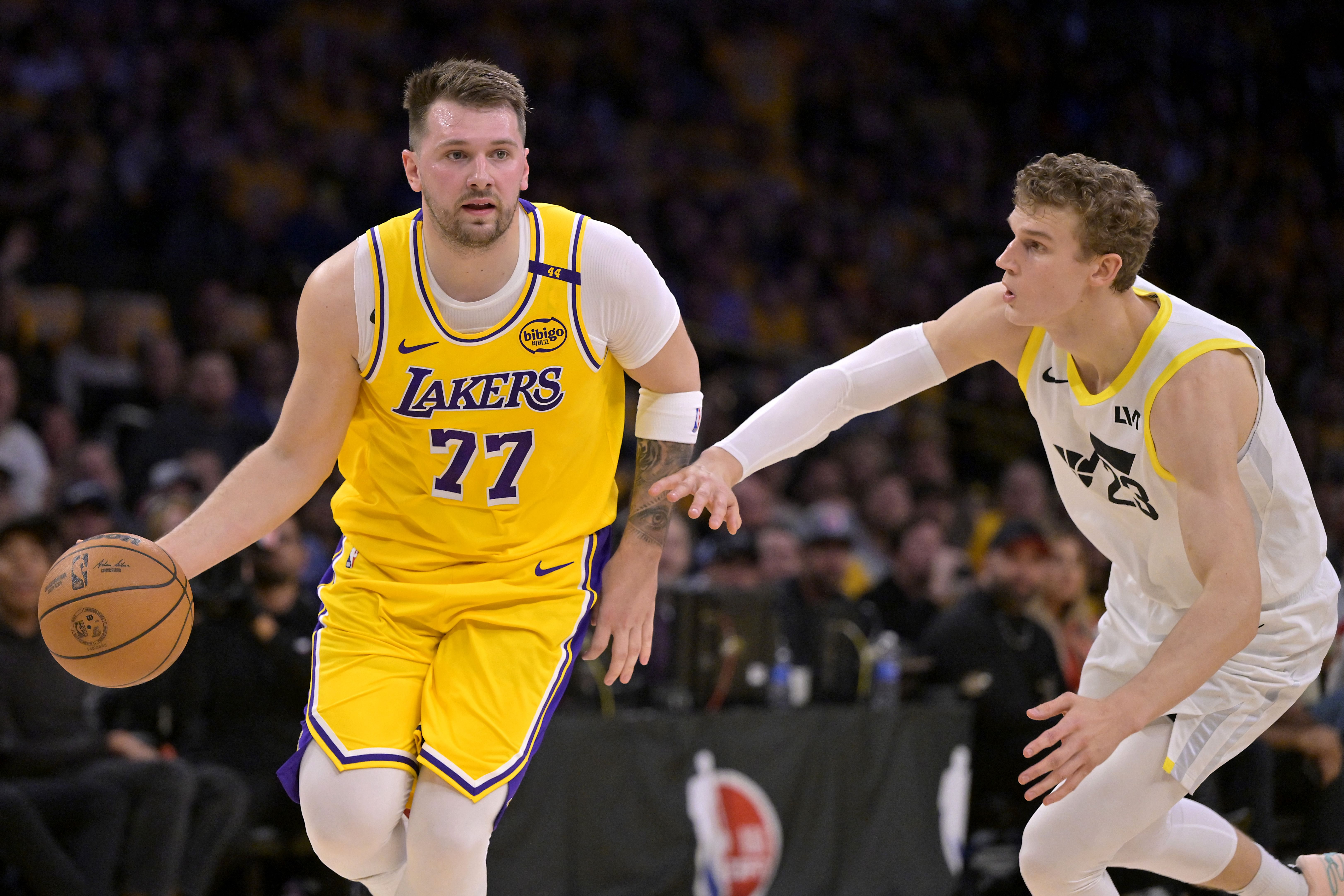 Los Angeles Lakers guard Luka Doncic is defended by Utah Jazz forward Lauri Markkanen at Crypto.com Arena. Photo Credit: Imagn