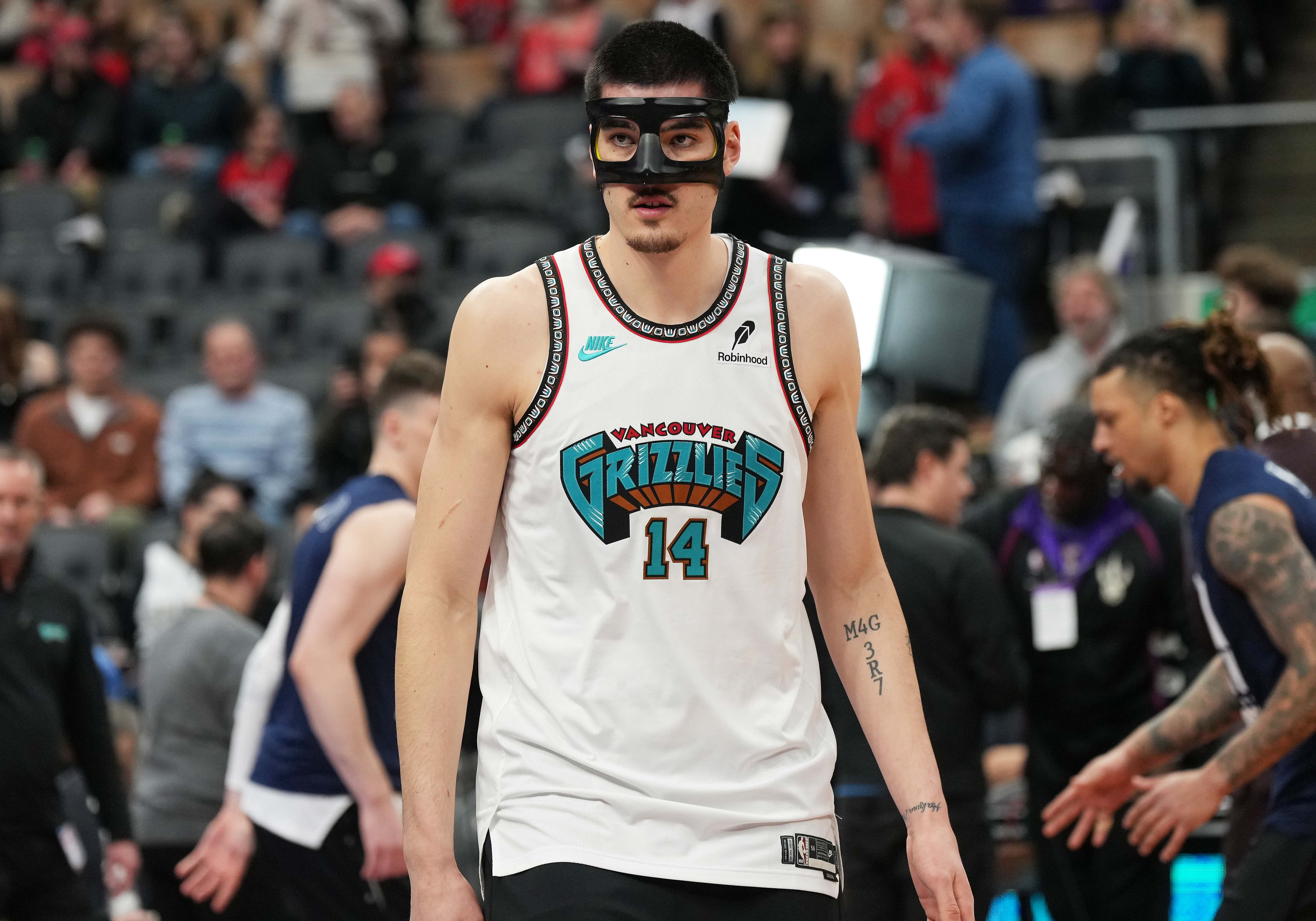 Memphis Grizzlies center Zach Edey wears a face guard during the warmup before a game against the Toronto Raptors at Scotiabank Arena. Photo Credit: Imagn