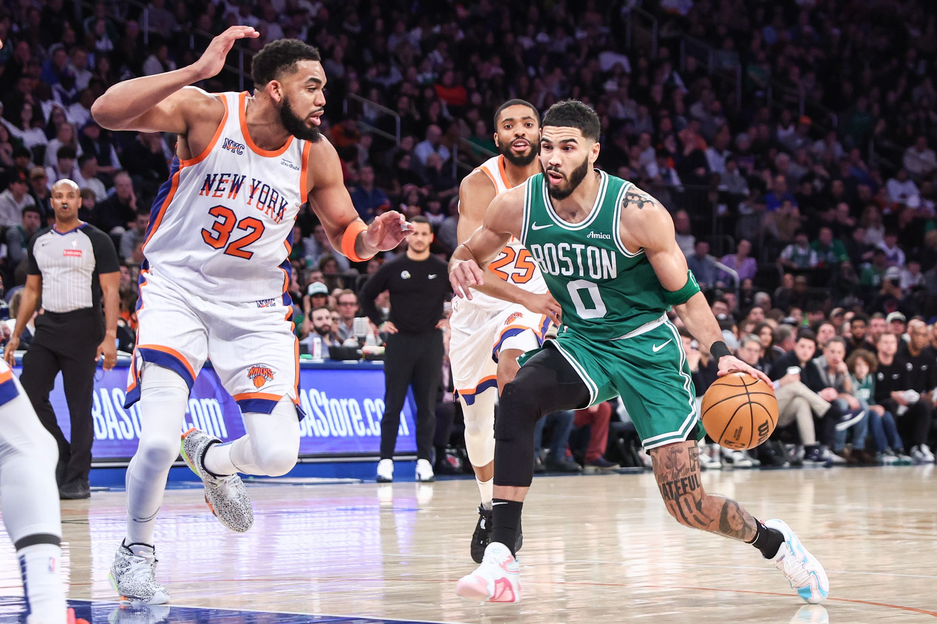 Feb 8, 2025; New York, New York, USA; Boston Celtics forward Jayson Tatum (0) and New York Knicks center Karl-Anthony Towns (32) at Madison Square Garden. Mandatory Credit: Wendell Cruz-Imagn Images - Source: Imagn