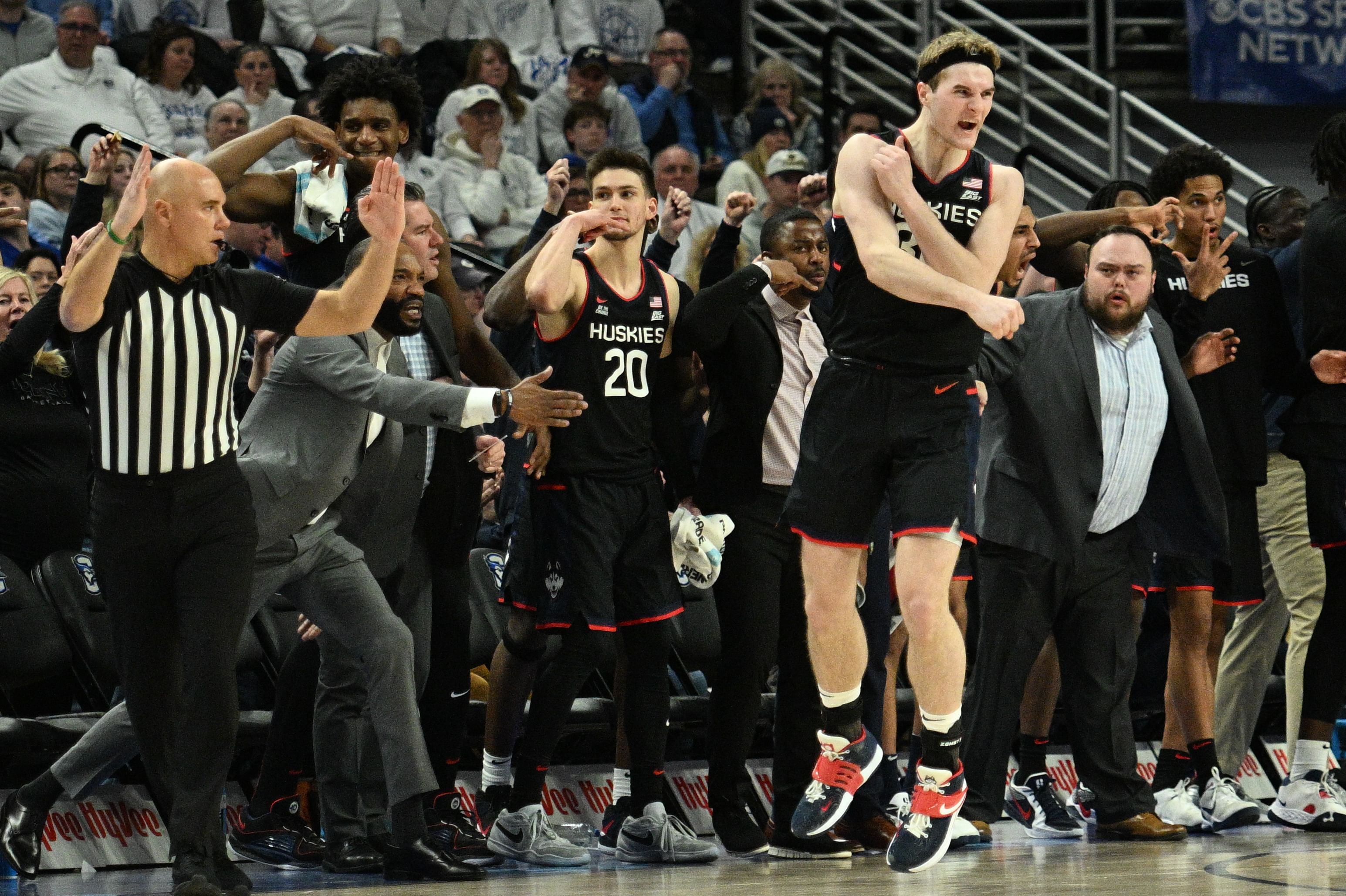 UConn Huskies forward Liam McNeeley (30) reacts after making a three-point basket against the Creighton Bluejays during the second half at CHI Health Center Omaha. Photo: Imagn