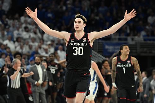 UConn Huskies forward Liam McNeeley (30) celebrates a basket against the Creighton Bluejays during the second half of their NCAA basketball game at CHI Health Center Omaha. Photo: Imagn