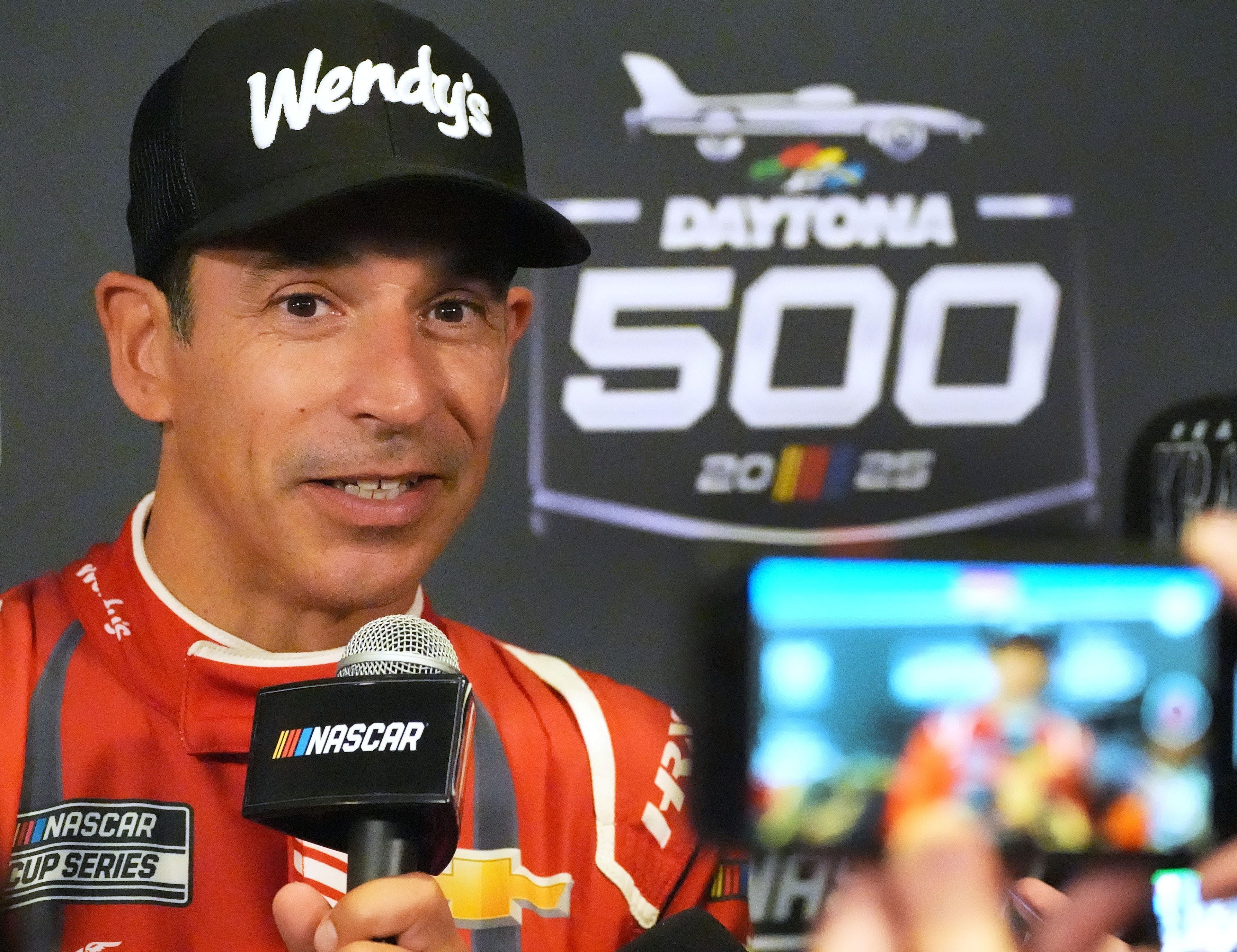 Helio Castroneves talks with reporters, Wednesday, February 12, 202,5 during Media Day for the Daytona 500 - Source: Imagn