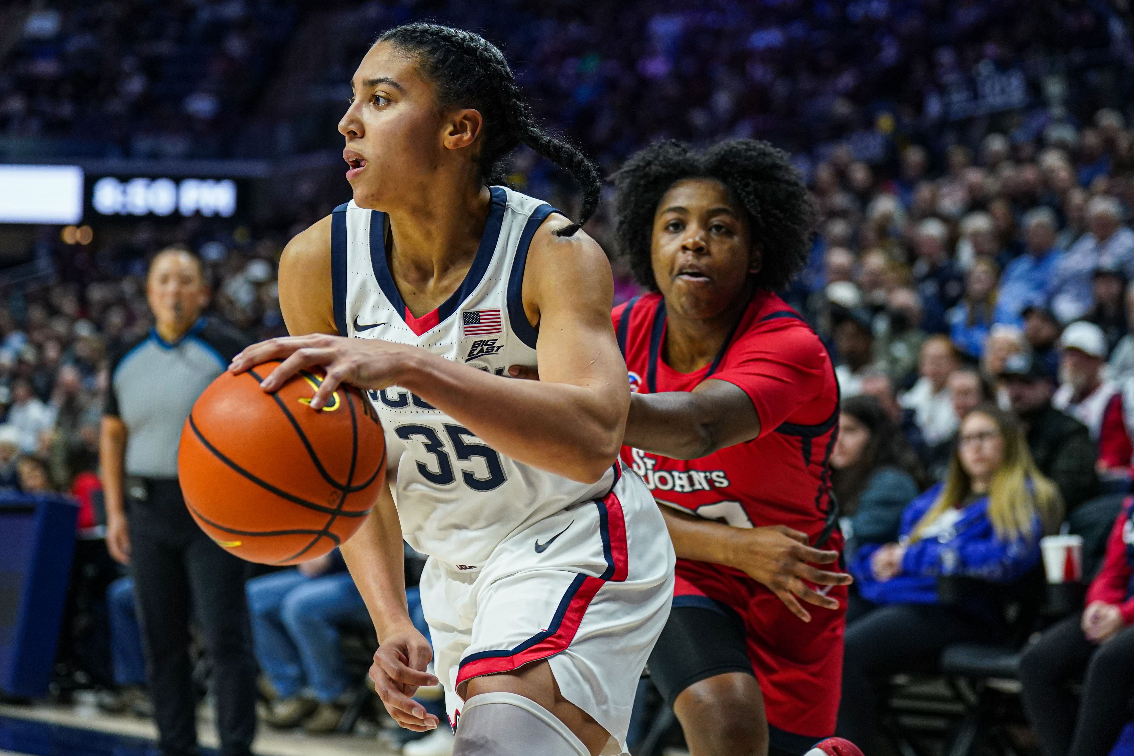 UConn Huskies guard Azzi Fudd (#35) drives the ball against St. John&#039;s Red Storm guard Ber&#039;Nyah Mayo (#23) in the second half at Harry A. Gampel Pavilion. Photo: Imagn