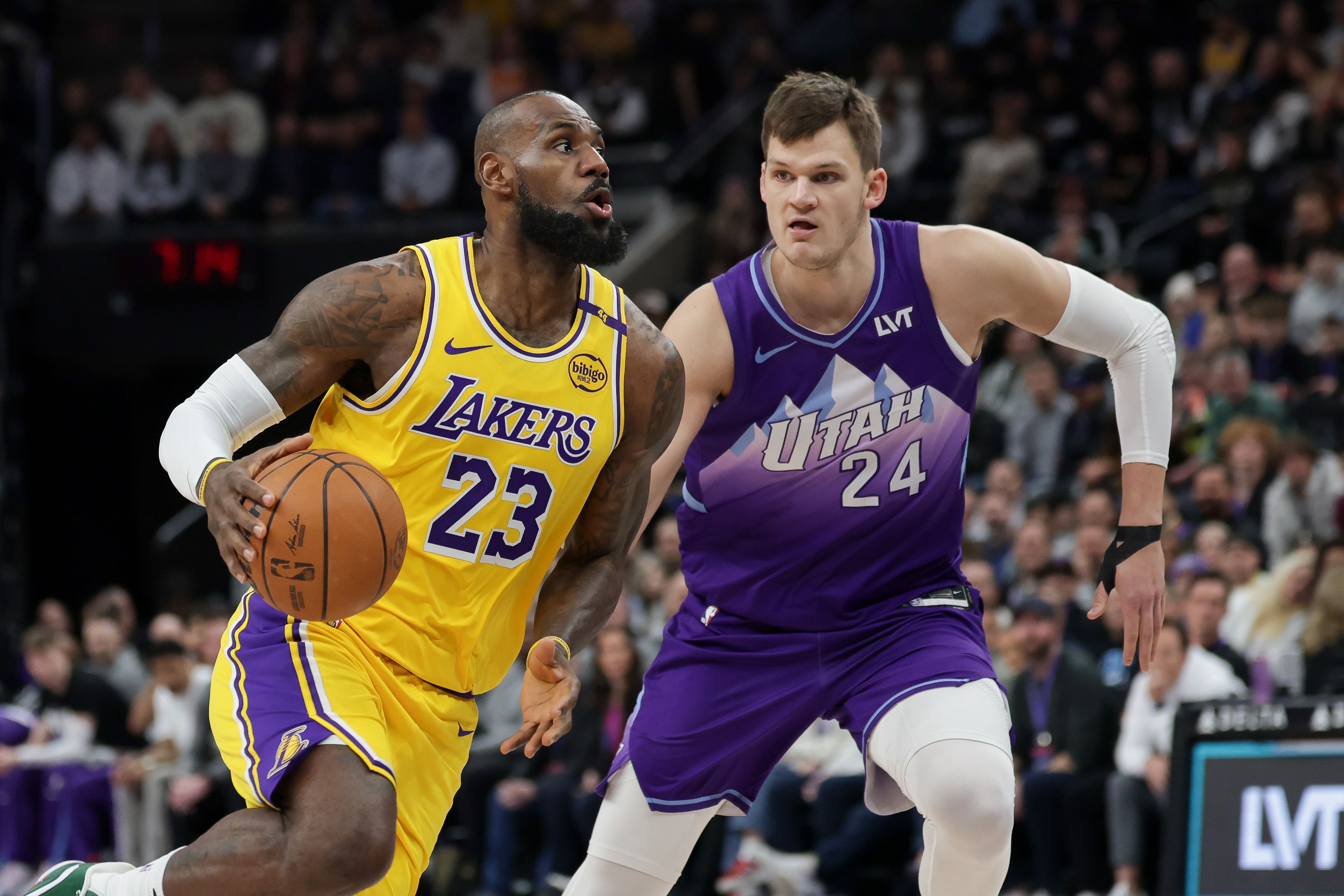 Los Angeles Lakers forward LeBron James dribbles past Utah Jazz center Walker Kessler at Delta Center. Photo Credit: Imagn