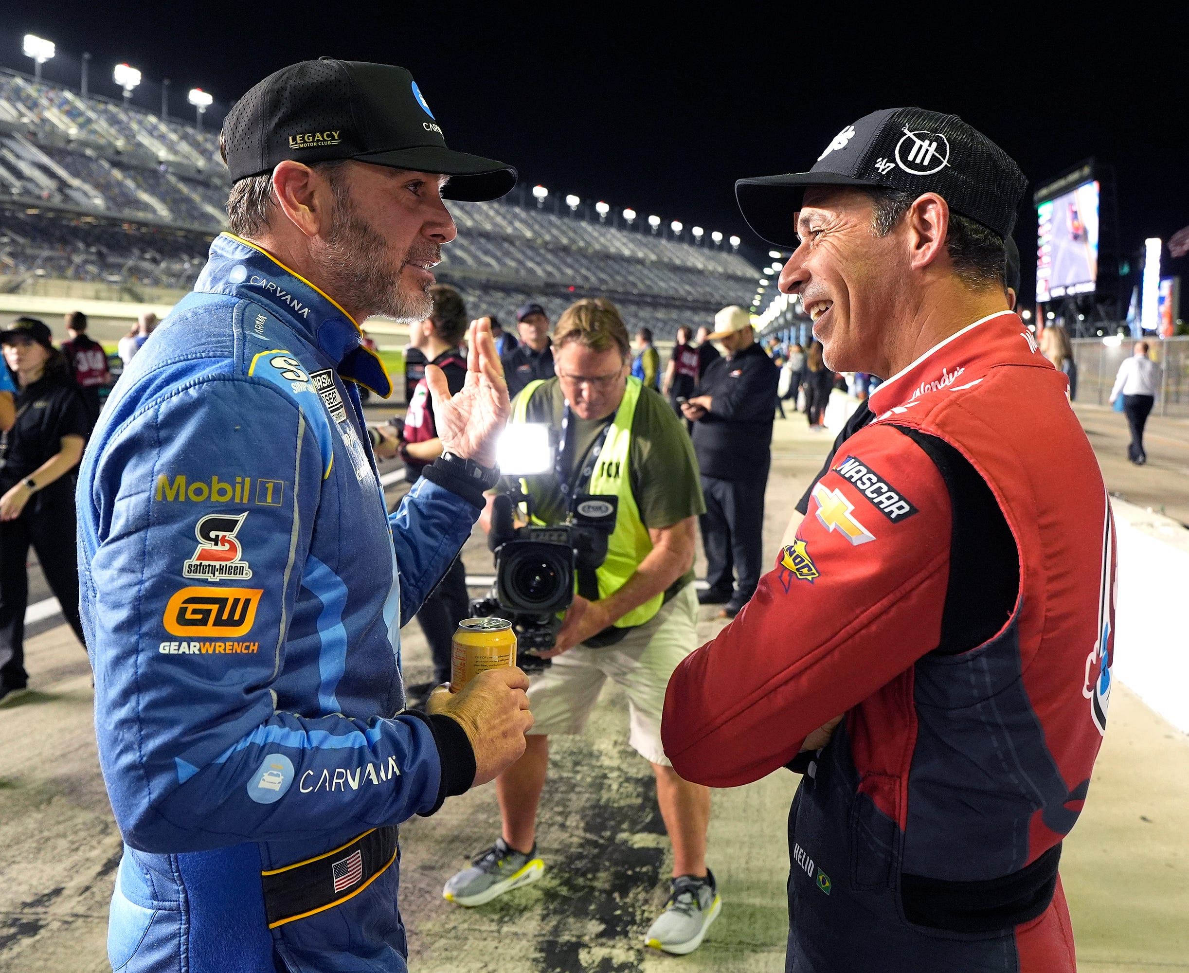 Helio Castroneves (right) with Jimmie Johnson (left) during the Daytona 500 race weekend - Source: Imagn