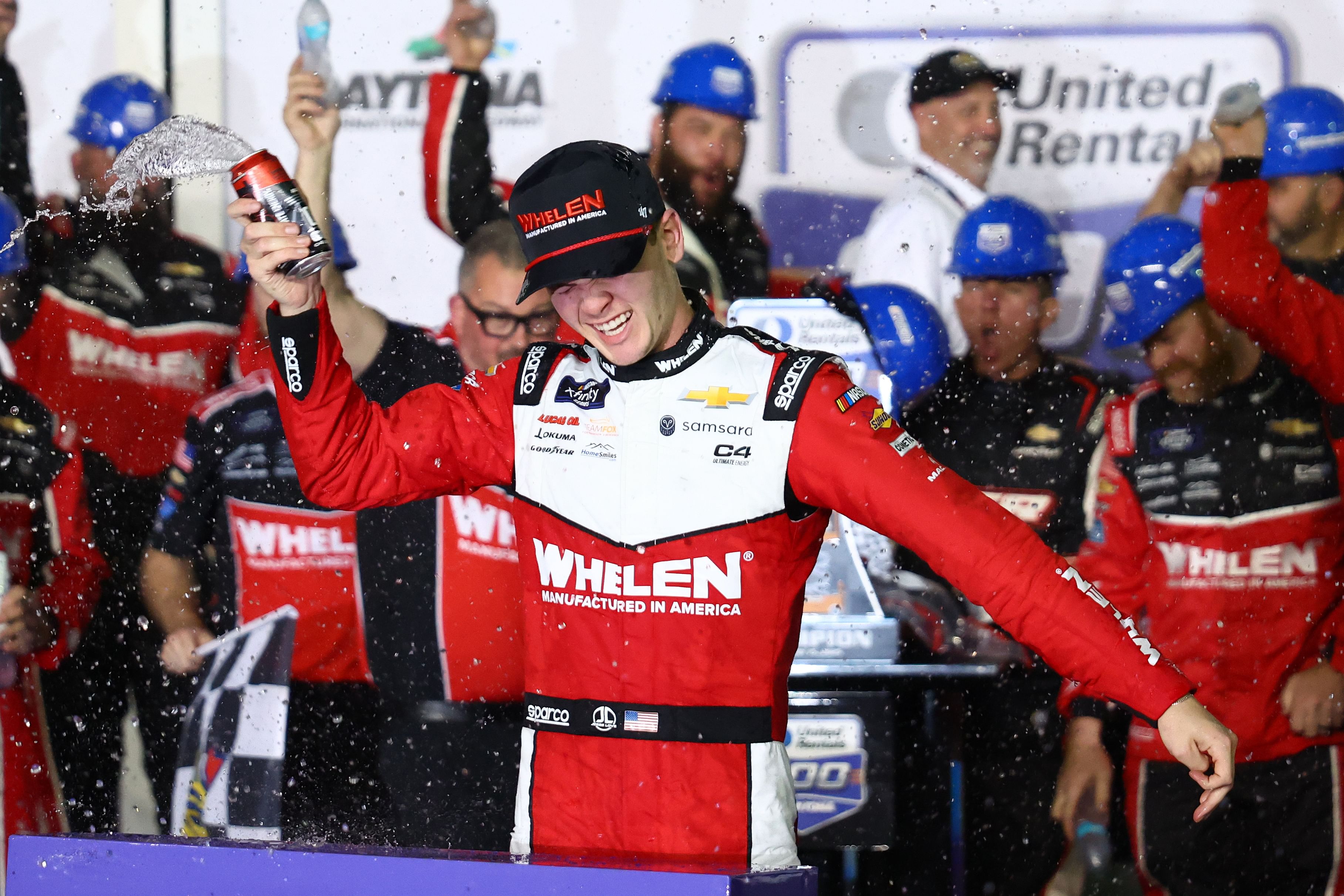 Feb 15, 2025; Daytona Beach, Florida, USA; Xfinity Series driver Jesse Love (2) reacts in victory lane after winning the United Rentals 300 at Daytona International Speedway. Mandatory Credit: Peter Casey-Imagn Images - Source: Imagn