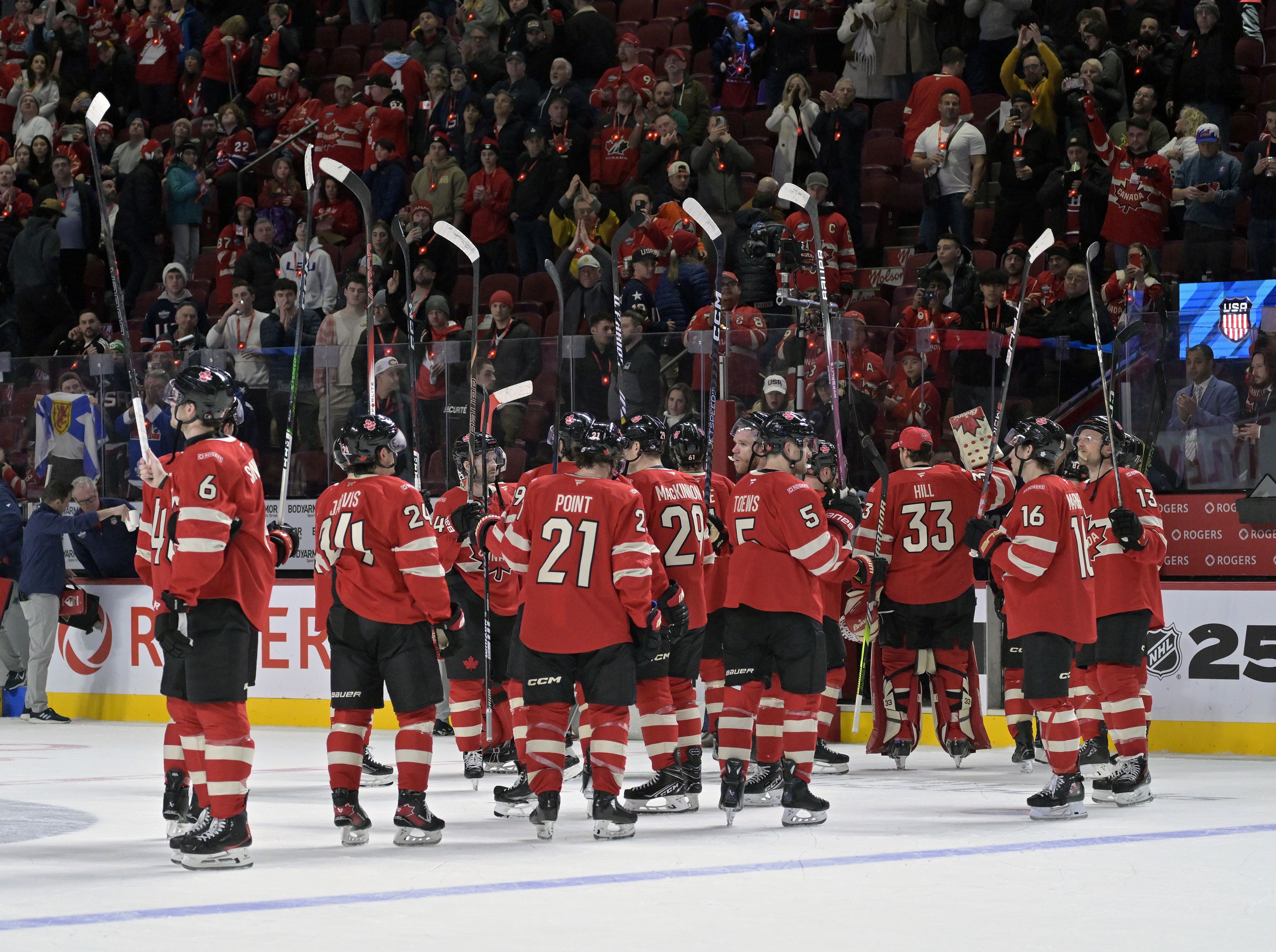 Feb 15, 2025; Montreal, Quebec, CAN; [Imagn Images direct customers only] Team Canada salutes the crowd after a defeat against Team United States during a 4 Nations Face-Off ice hockey game at the Bell Centre. Mandatory Credit: Eric Bolte-Imagn Images - Source: Imagn