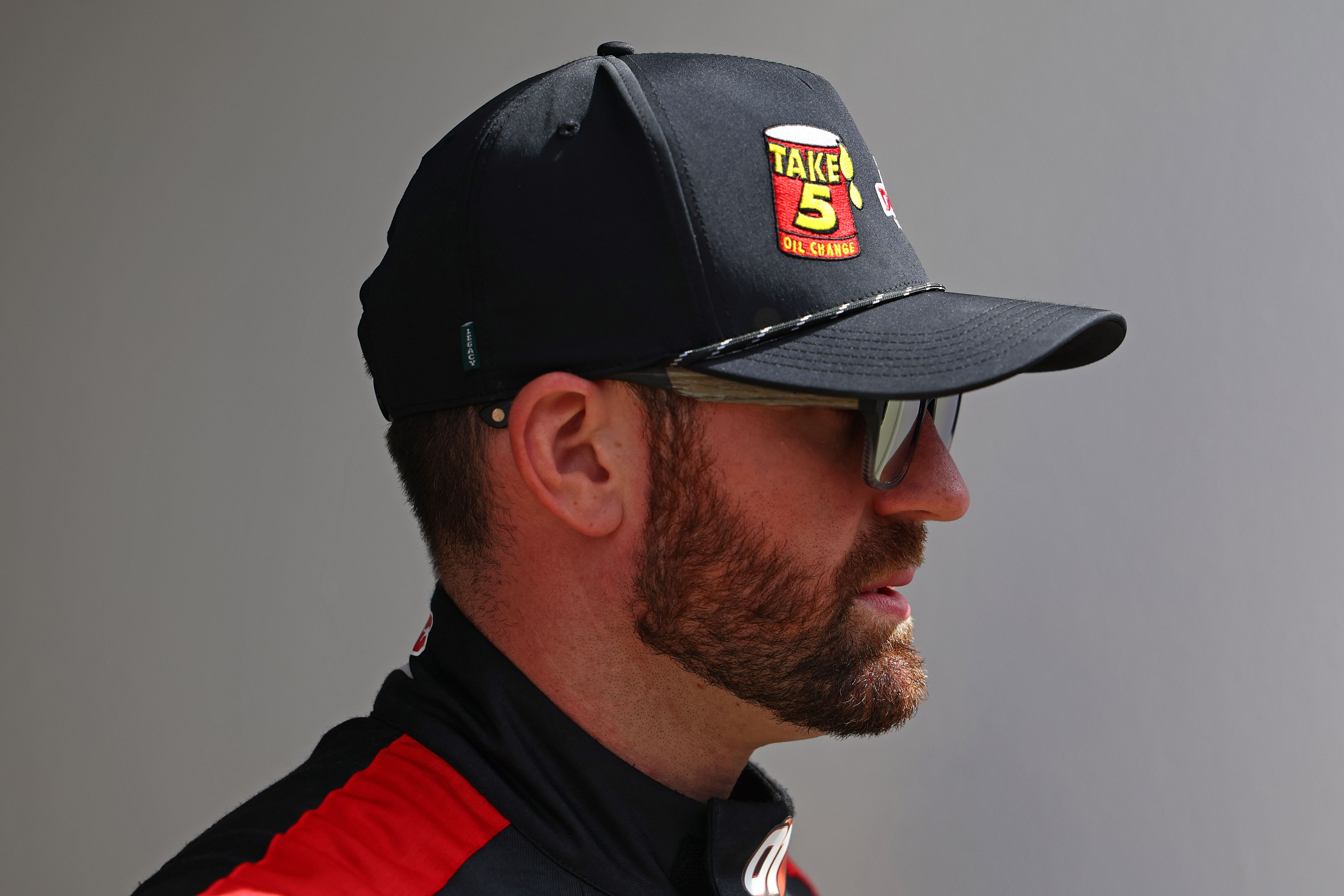 Corey LaJoie walks to the drivers meeting before the Daytona 500 at Daytona International Speedway - Source: Imagn