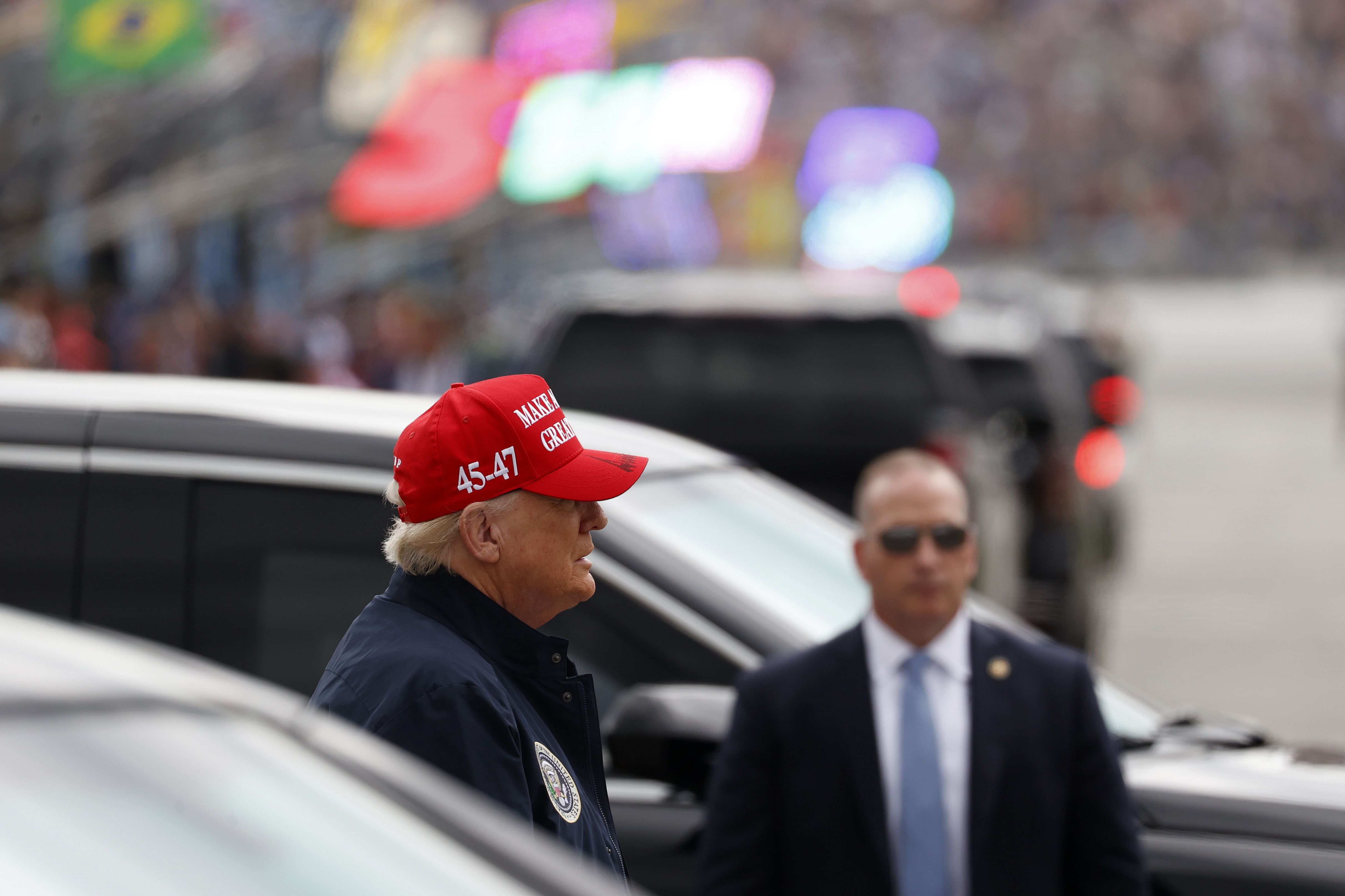 US President Donald Trump at the pit lane during the 2025 Daytona 500 - Source: Imagn