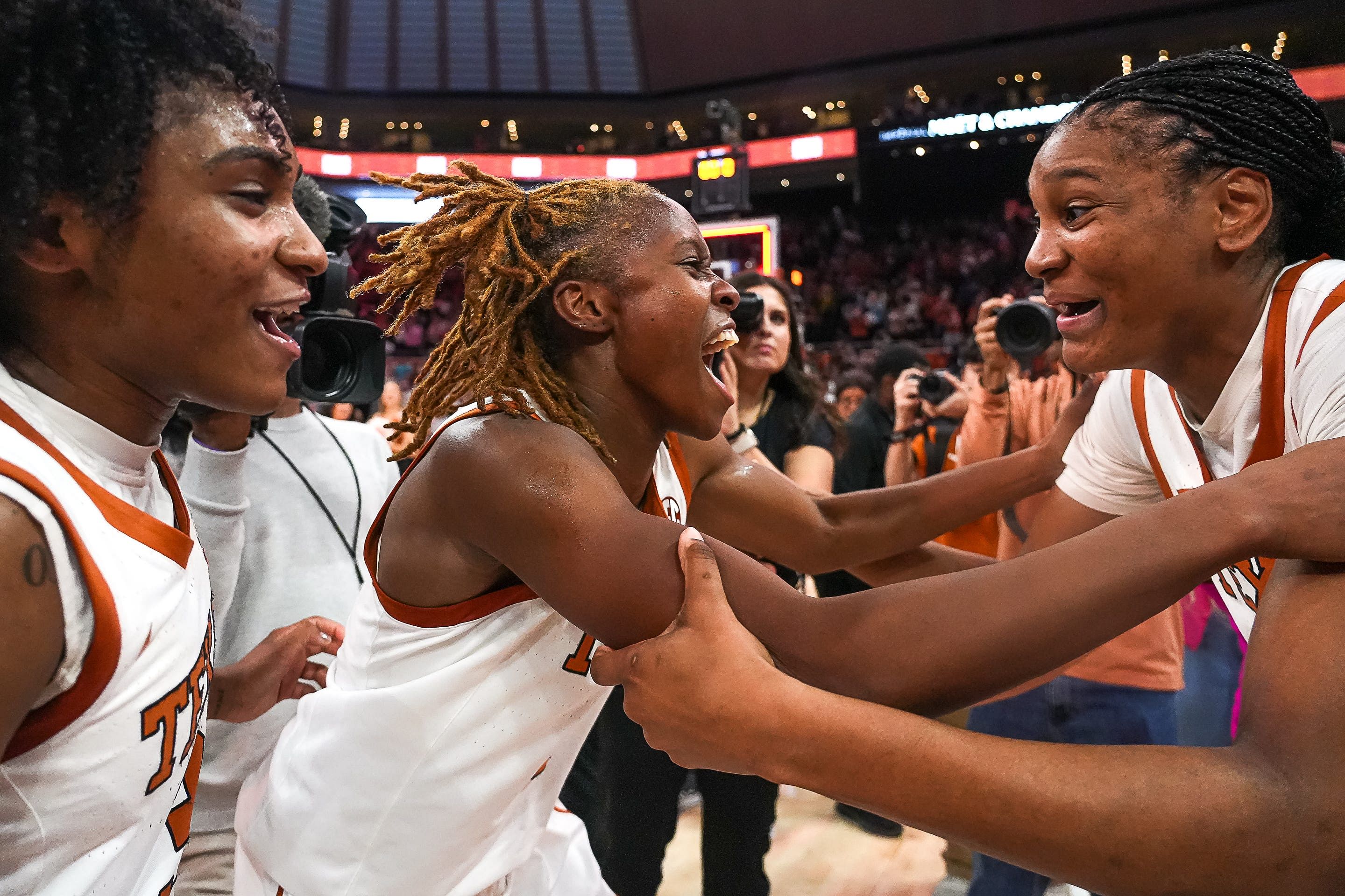 From right, Texas Longhorns guards Madison Booker, Bryanna Preston, and Rori Harmon celebrate the 65-58 win over LSU at the Moody Center on Sunday, Feb. 16, 2025. - Source: Imagn