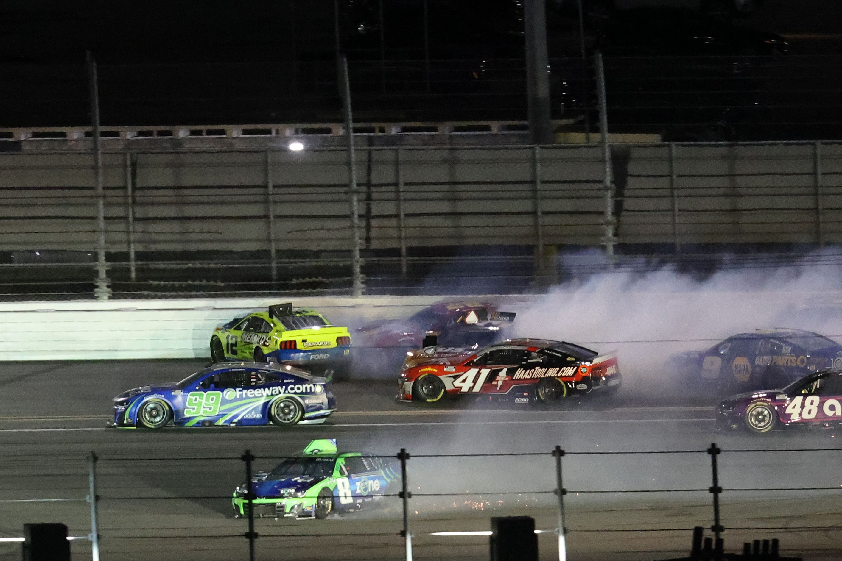 NASCAR Cup Series driver Ryan Blaney (12), driver Joey Logano (22) and driver Kyle Busch (8) wreck on the back stretch during the Daytona 500 at Daytona International Speedway. - Source: Imagn