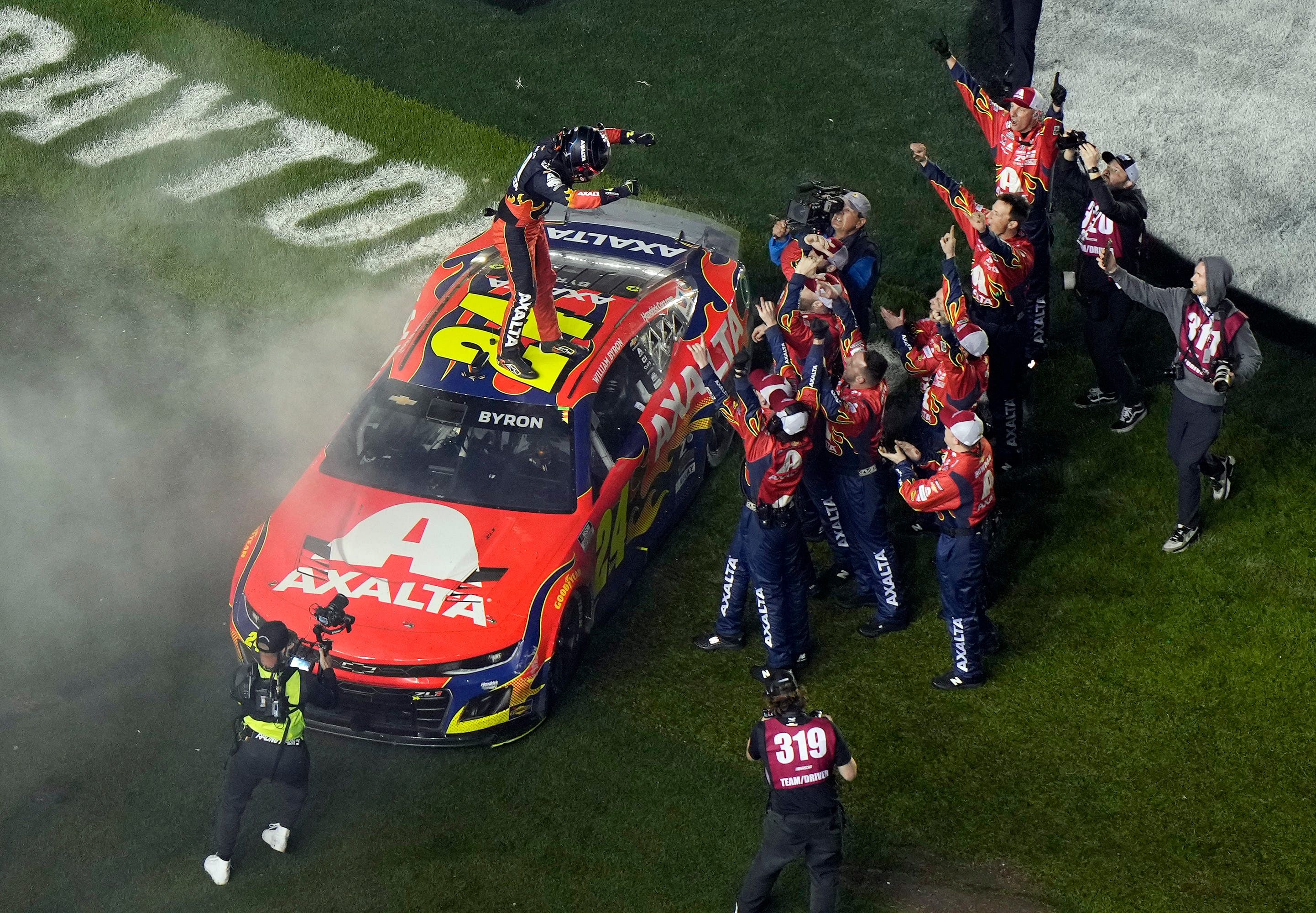 William Byron celebrates on top of his car after his win - Source: Imagn