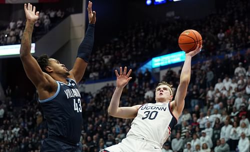 UConn Huskies forward Liam McNeeley (#30) shoots the ball against Villanova Wildcats forward Eric Dixon (43) in the first half of their NCAA basketball game at XL Center. Photo: Imagn