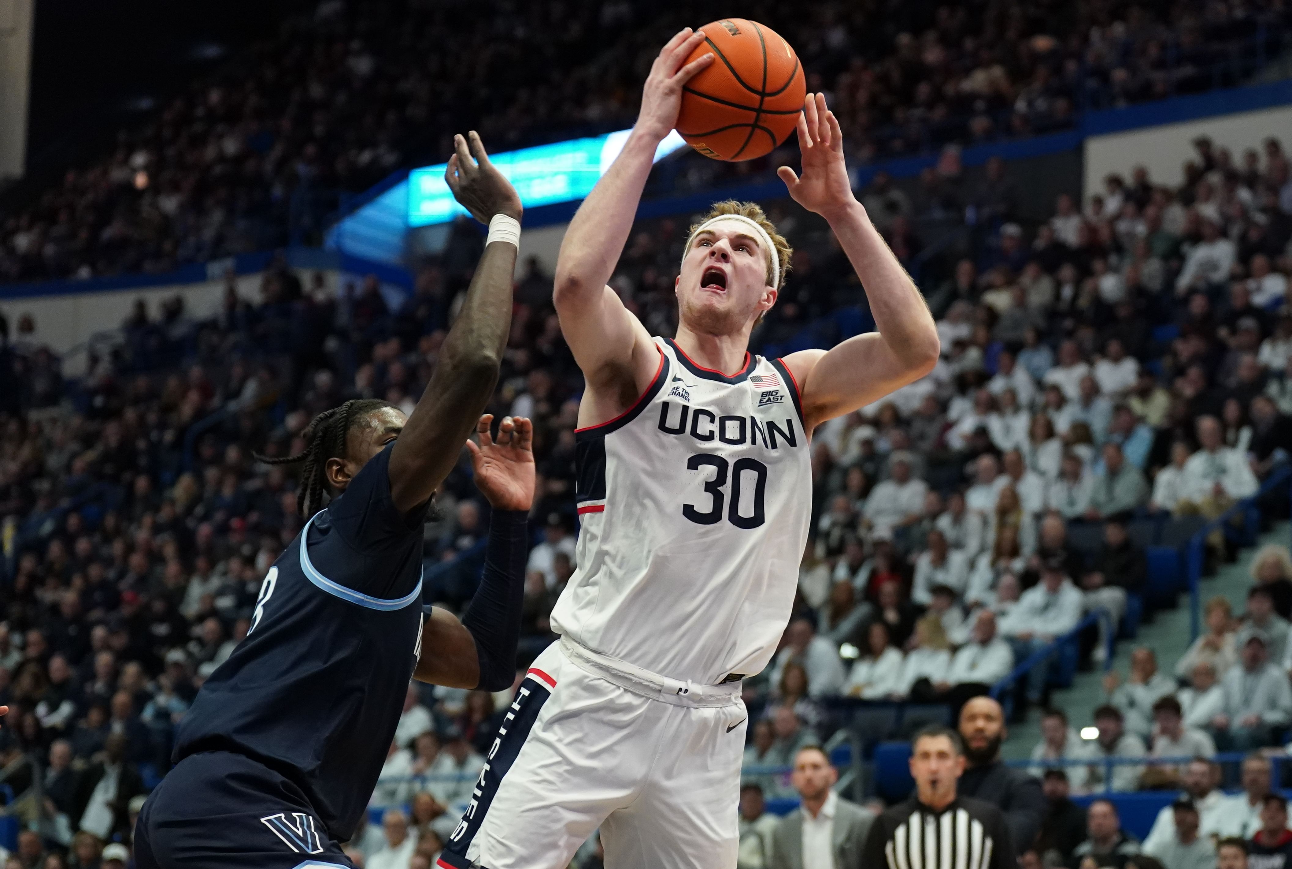 UConn Huskies forward Liam McNeeley (30) shoots the ball against the Villanova Wildcats in the first half of their NCAA game at XL Center. Photo: Imagn