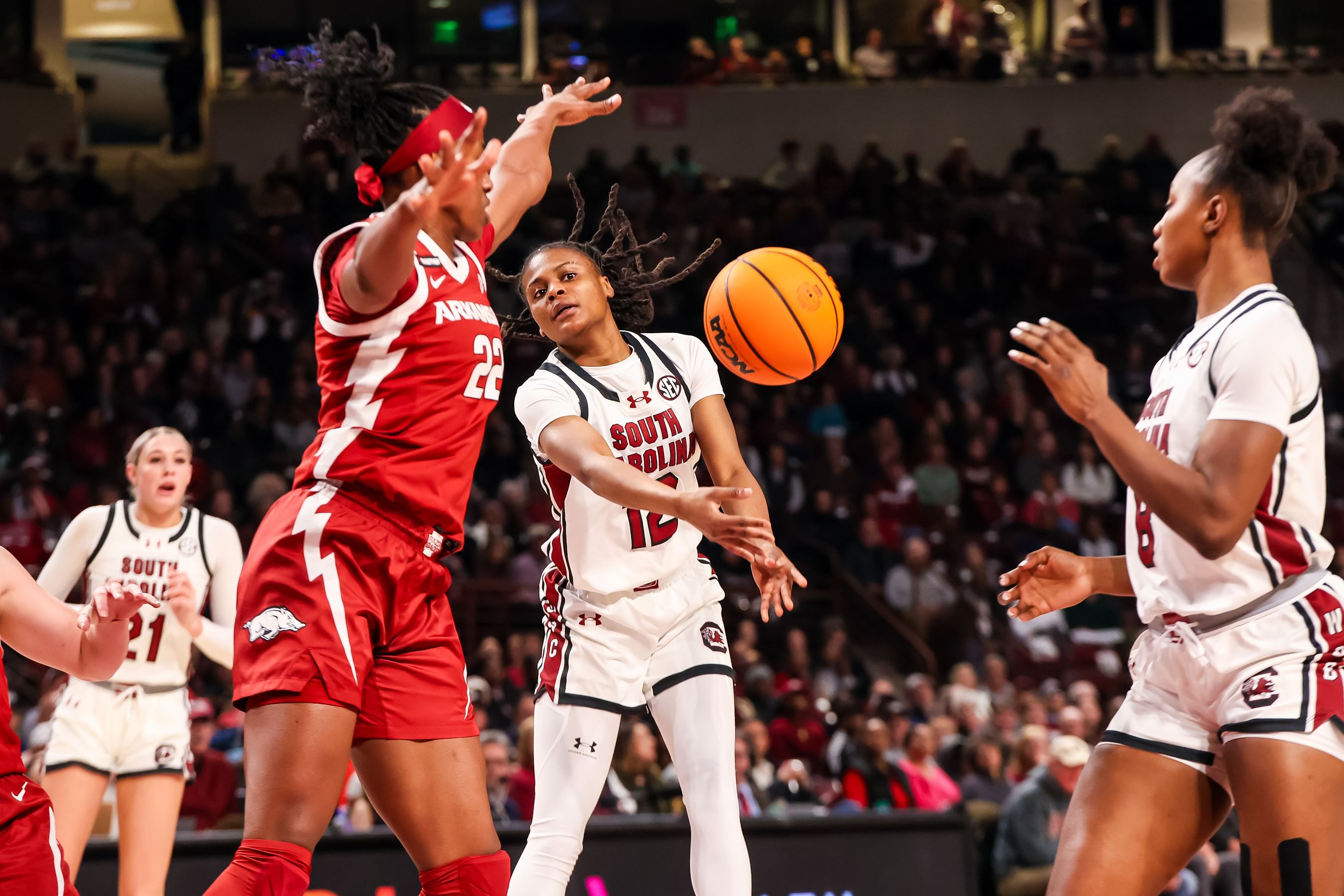 South Carolina Gamecocks guard MiLaysia Fulwiley (#12) passes to forward Joyce Edwards (#8) around Arkansas Razorbacks forward Vera Ojenuwa (#22) in the first half at Colonial Life Arena. Photo: Imagn