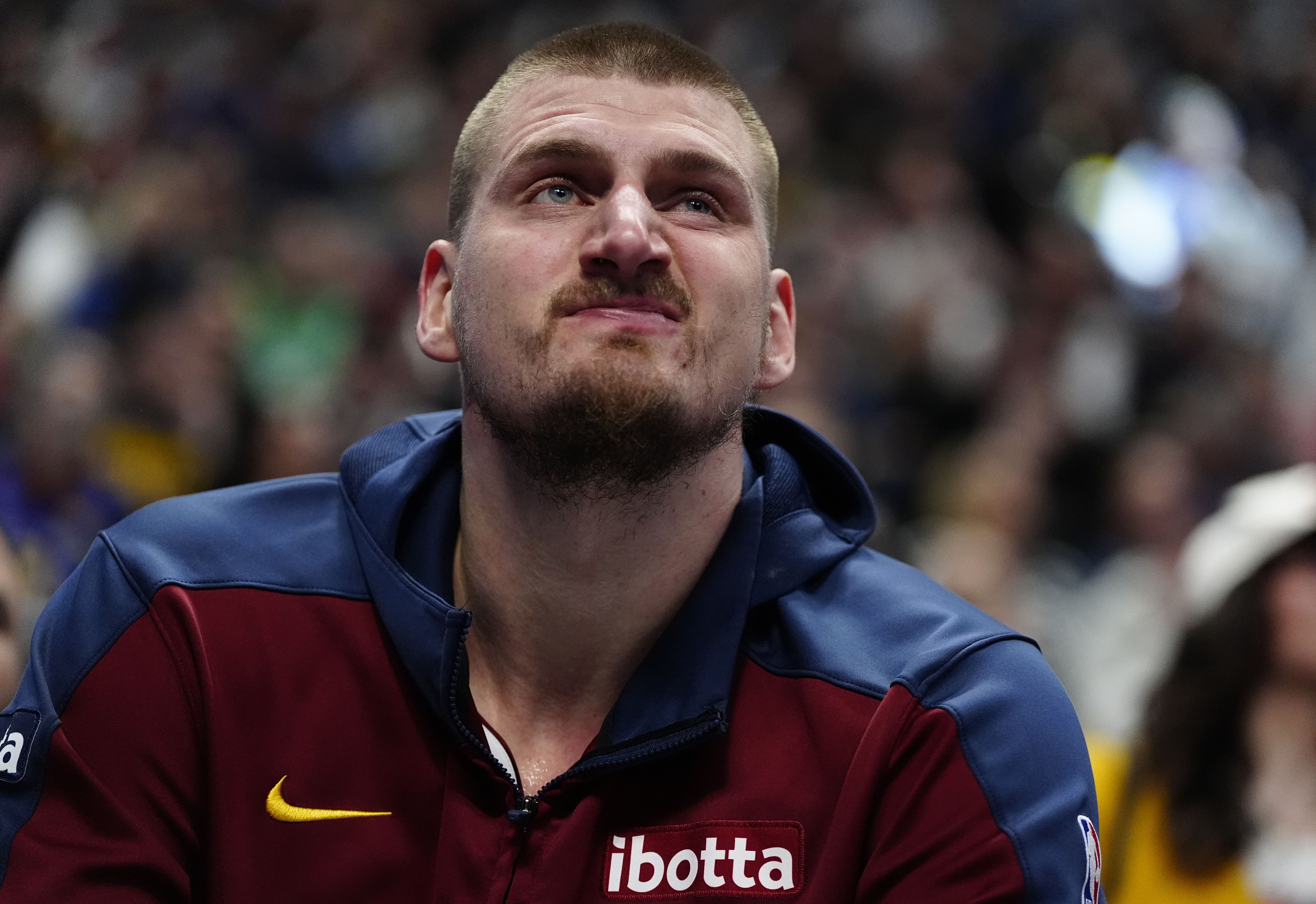 Feb 20, 2025; Denver, Colorado, USA; Denver Nuggets center Nikola Jokic (15) reacts on the bench in the second half against the Charlotte Hornets at Ball Arena. Mandatory Credit: Ron Chenoy-Imagn Images - Source: Imagn