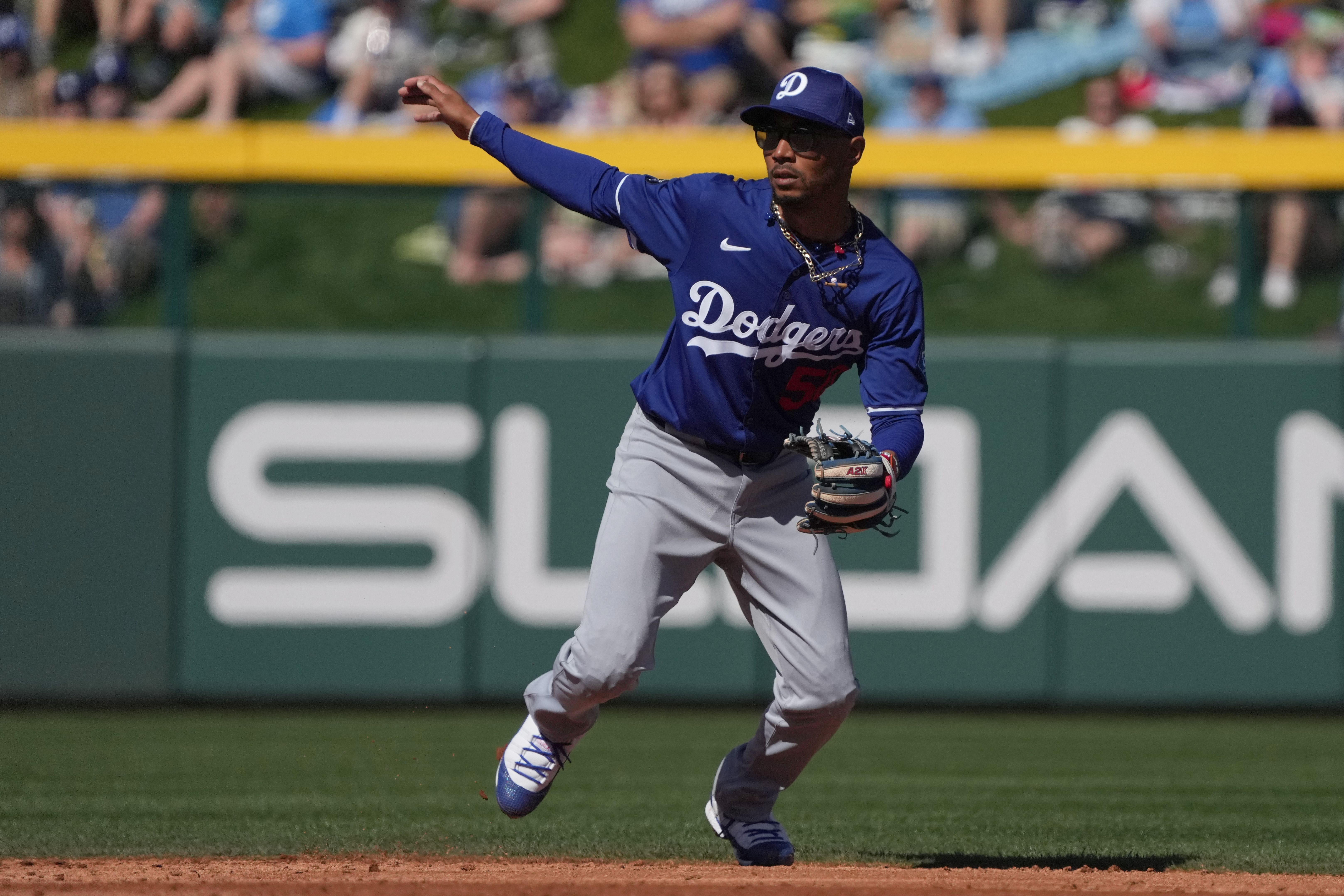 Feb 21, 2025; Mesa, Arizona, USA; Los Angeles Dodgers shortstop Mookie Betts (50) moves with the pitch against the Chicago Cubs during the second inning at Sloan Park. Mandatory Credit: Rick Scuteri-Imagn Images - Source: Imagn