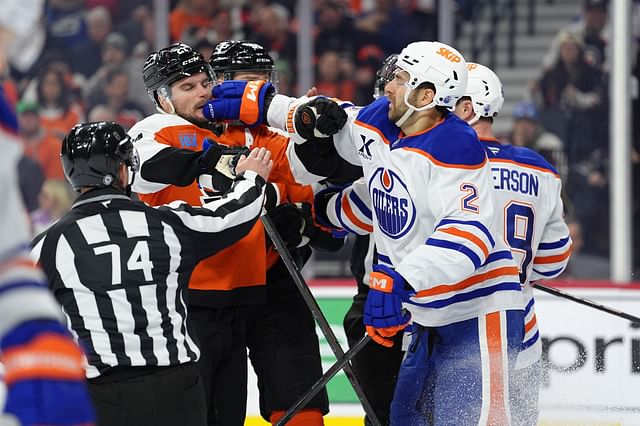 Feb 22, 2025; Philadelphia, Pennsylvania, USA; Edmonton Oilers defenseman Evan Bouchard (2) punches Philadelphia Flyers center Scott Laughton (21) in the third period at Wells Fargo Center. Mandatory Credit: Kyle Ross-Imagn Images - Source: Imagn