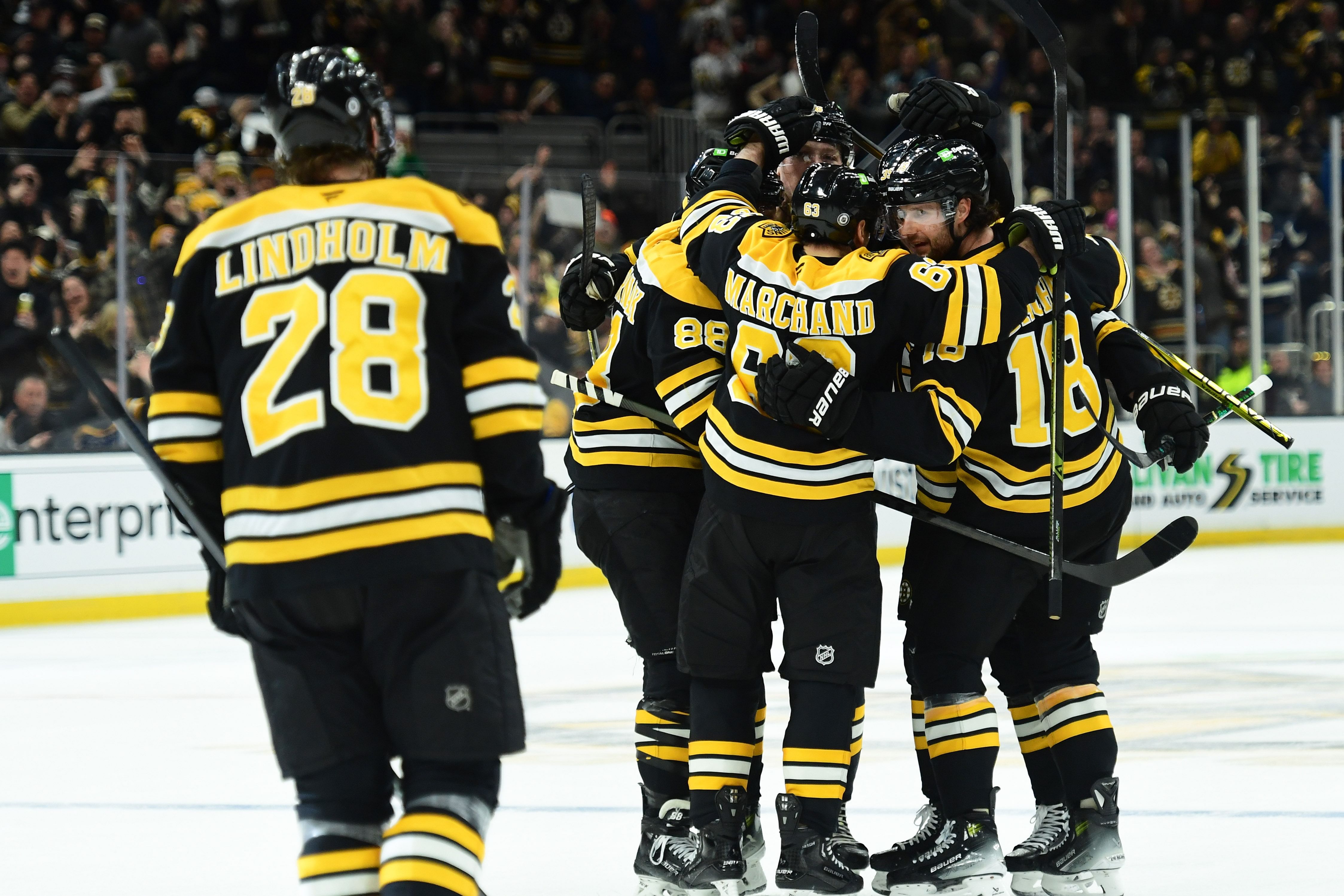 Feb 22, 2025; Boston, Massachusetts, USA; Boston Bruins right wing David Pastrnak (88) left wing Brad Marchand (63) center Pavel Zacha (18) celebrate a goal by center Morgan Geekie (39) during the third period against the Anaheim Ducks at TD Garden. Mandatory Credit: Bob DeChiara-Imagn Images - Source: Imagn