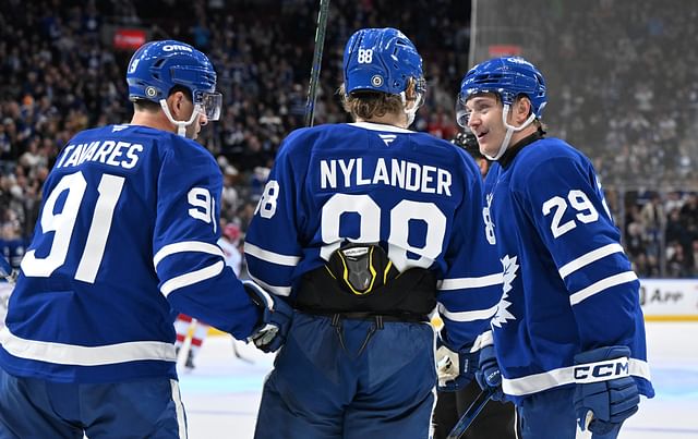 Feb 22, 2025; Toronto, Ontario, CAN; Toronto Maple Leafs forward Pontus Holmberg (29) celebrates with forwards William Nylander (88) and John Tavares (91) after scoring a goal against the Carolina Hurricanes in the third period at Scotiabank Arena. Mandatory Credit: Dan Hamilton-Imagn Images - Source: Imagn