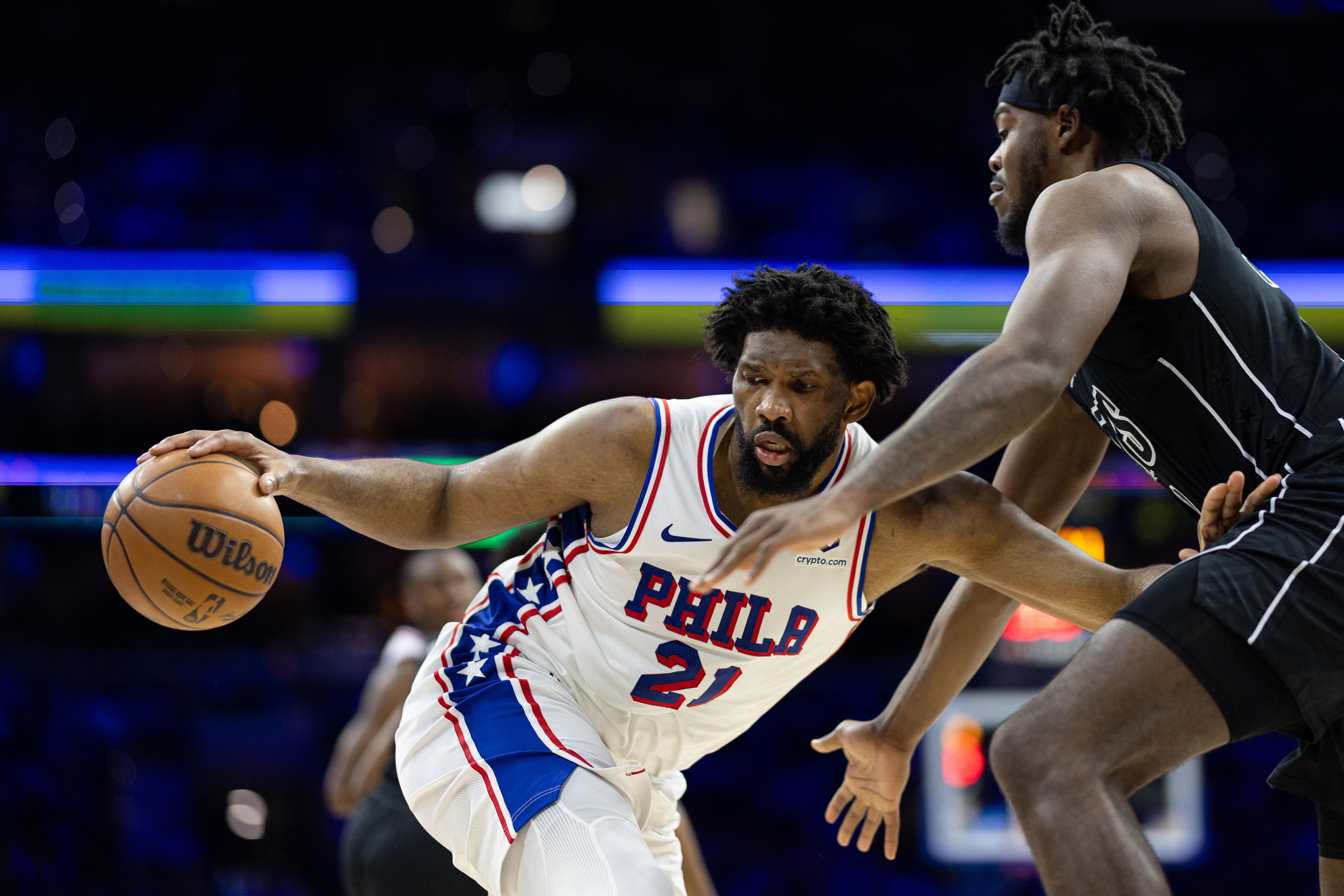 Feb 22, 2025; Philadelphia, Pennsylvania, USA; Philadelphia 76ers center Joel Embiid (21) controls the ball against Brooklyn Nets center Day